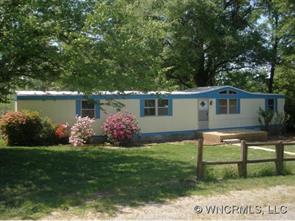2017 West V Thompson Road Rutherfordton, NC 28139 - Photo 1 of 12 a view of a house with a yard and a garden