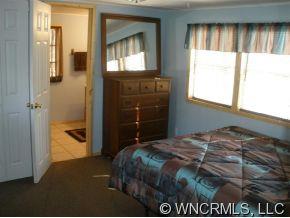 2017 West V Thompson Road Rutherfordton, NC 28139 - Photo 10 of 12 a bedroom with a bed and a window