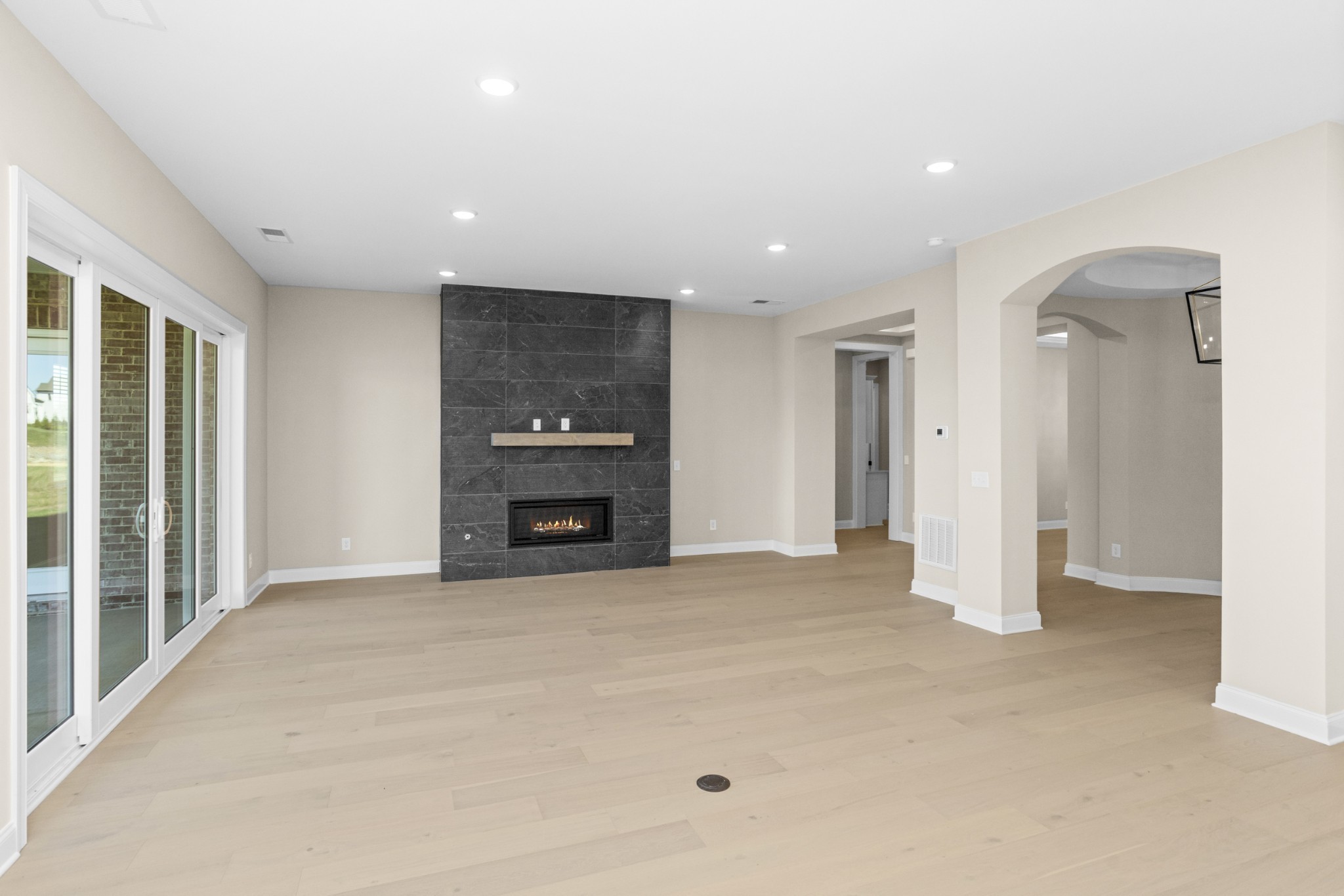 5955 Hunt Vly Drive Spring Hill, TN 37174 - Photo 11 of 59 an empty room with fireplace and windows