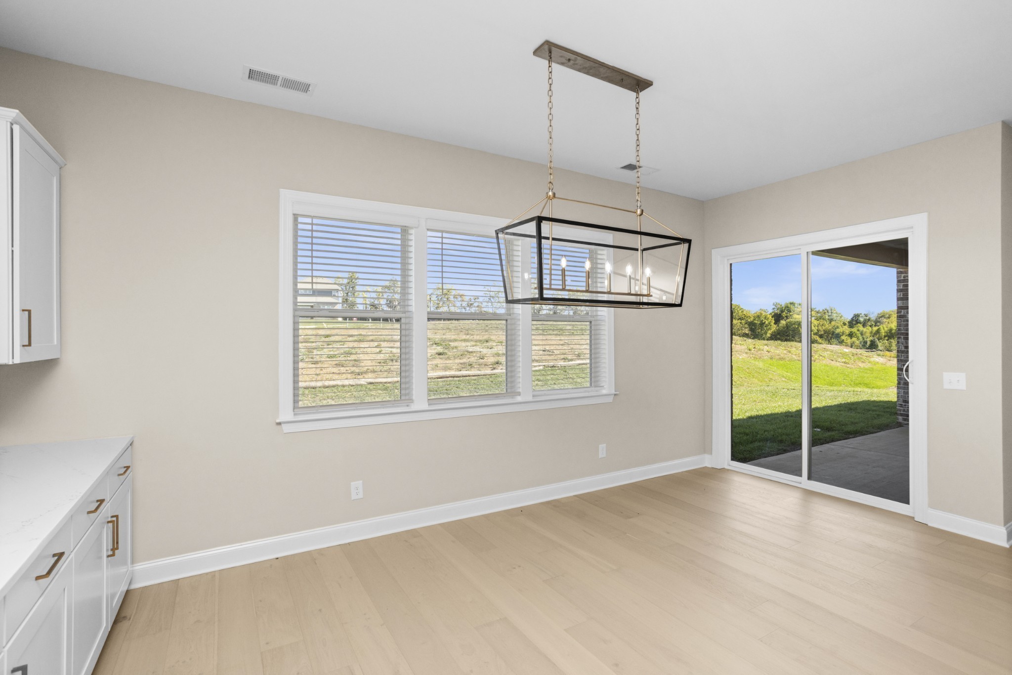 5955 Hunt Vly Drive Spring Hill, TN 37174 - Photo 14 of 59 a view of an empty room with glass door and a window