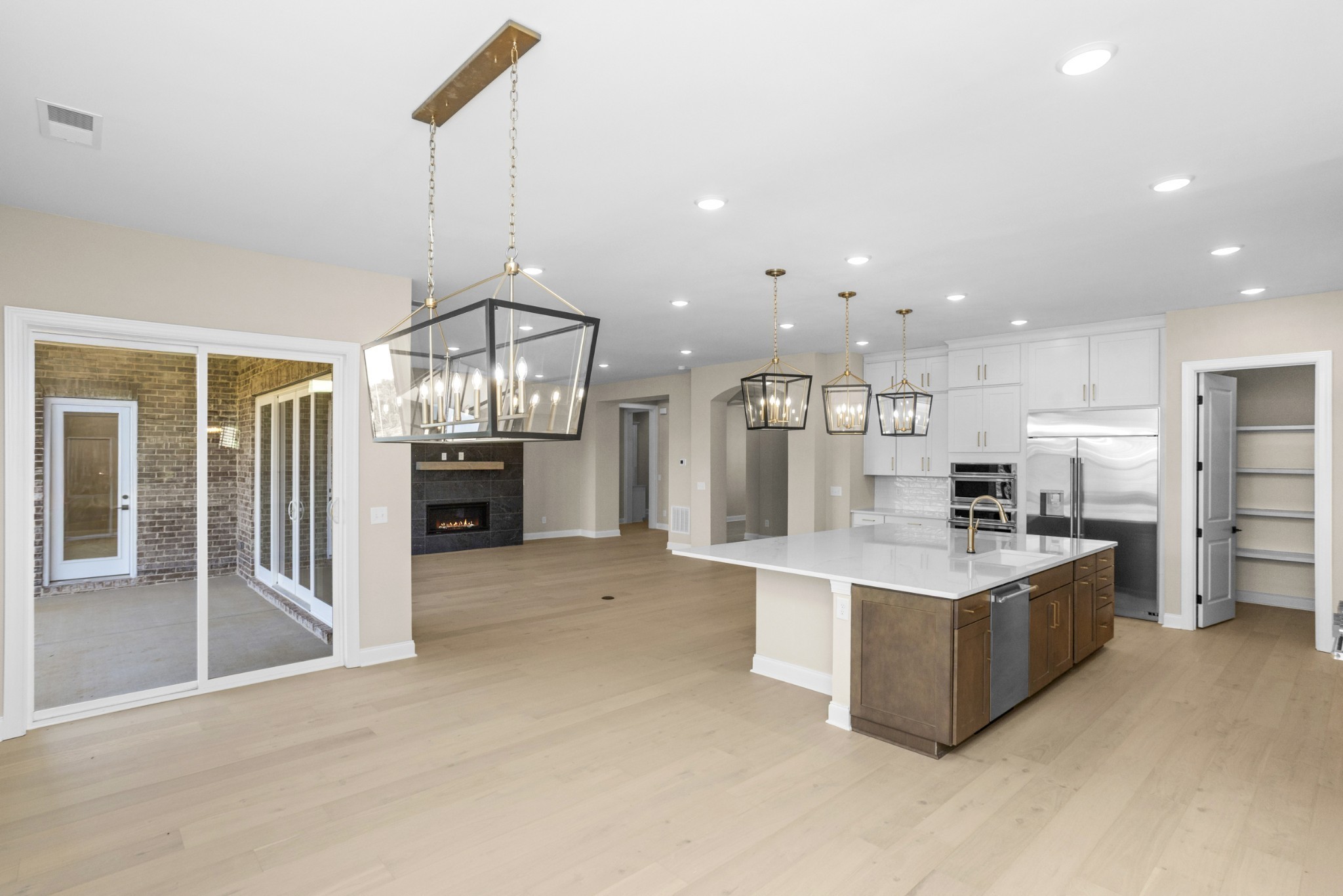 5955 Hunt Vly Drive Spring Hill, TN 37174 - Photo 17 of 59 a large kitchen with kitchen island a large counter top appliances and cabinets