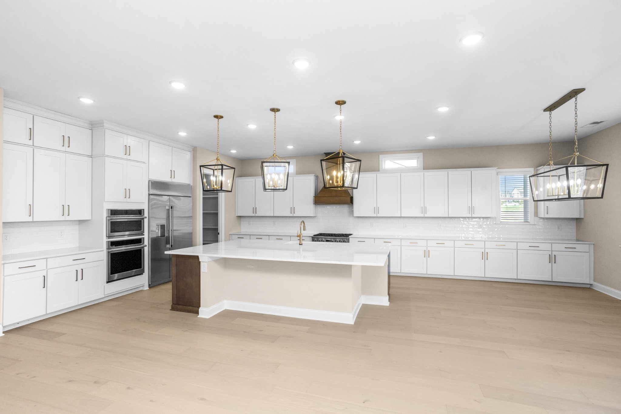 5955 Hunt Vly Drive Spring Hill, TN 37174 - Photo 22 of 59 a large kitchen with a large counter top stainless steel appliances and cabinets