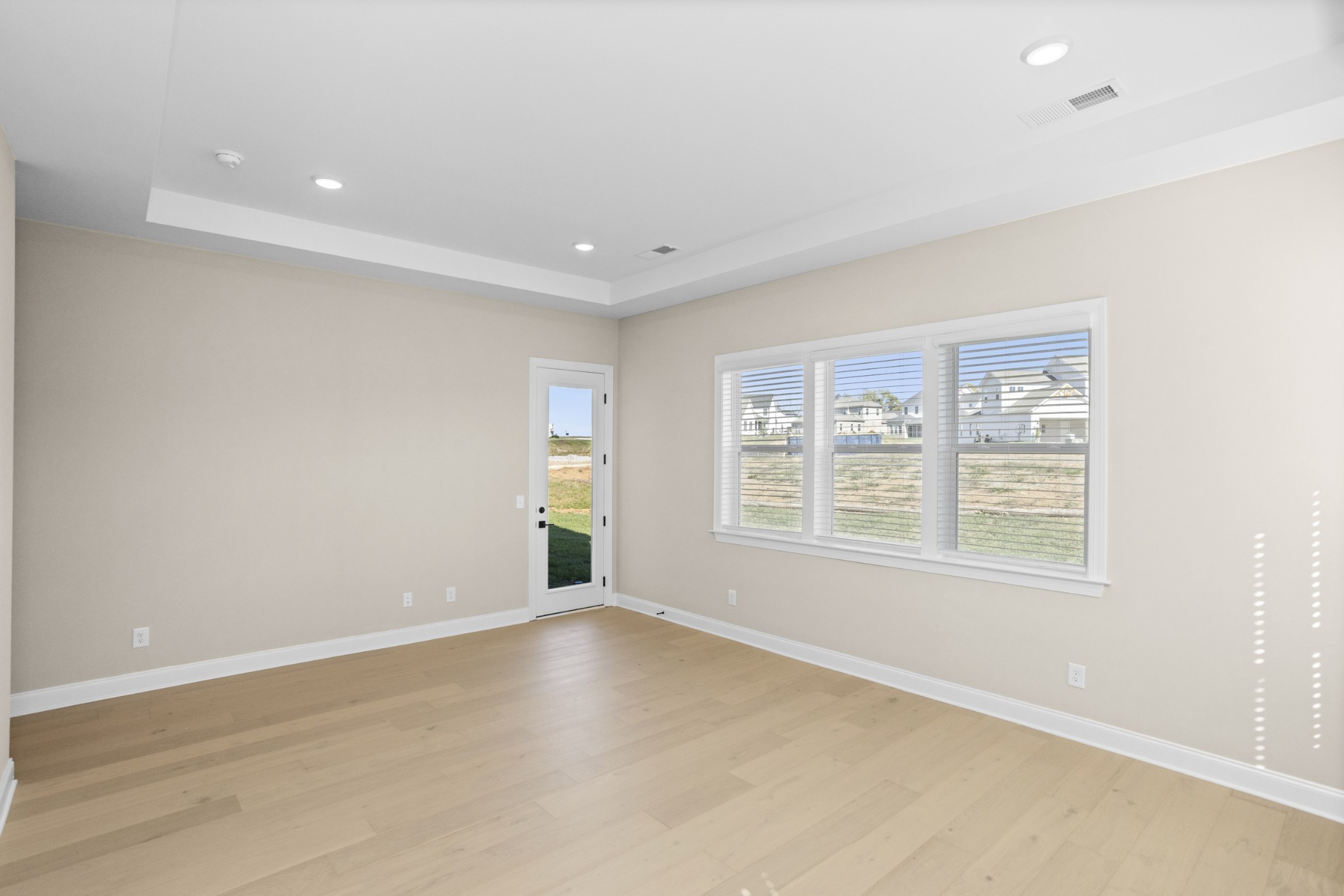 5955 Hunt Vly Drive Spring Hill, TN 37174 - Photo 25 of 59 an empty room with wooden floor and windows