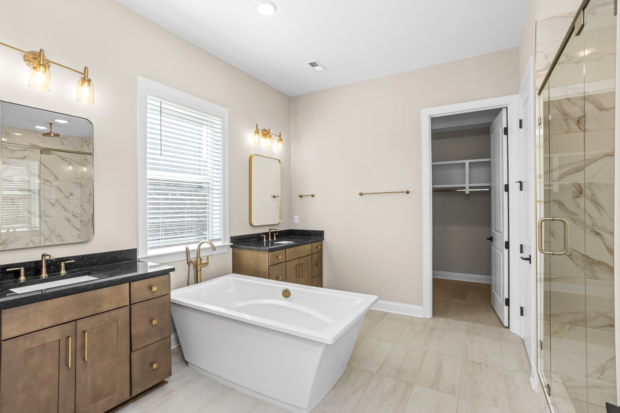 5955 Hunt Vly Drive Spring Hill, TN 37174 - Photo 27 of 59 a bathroom with a tub sink and mirror