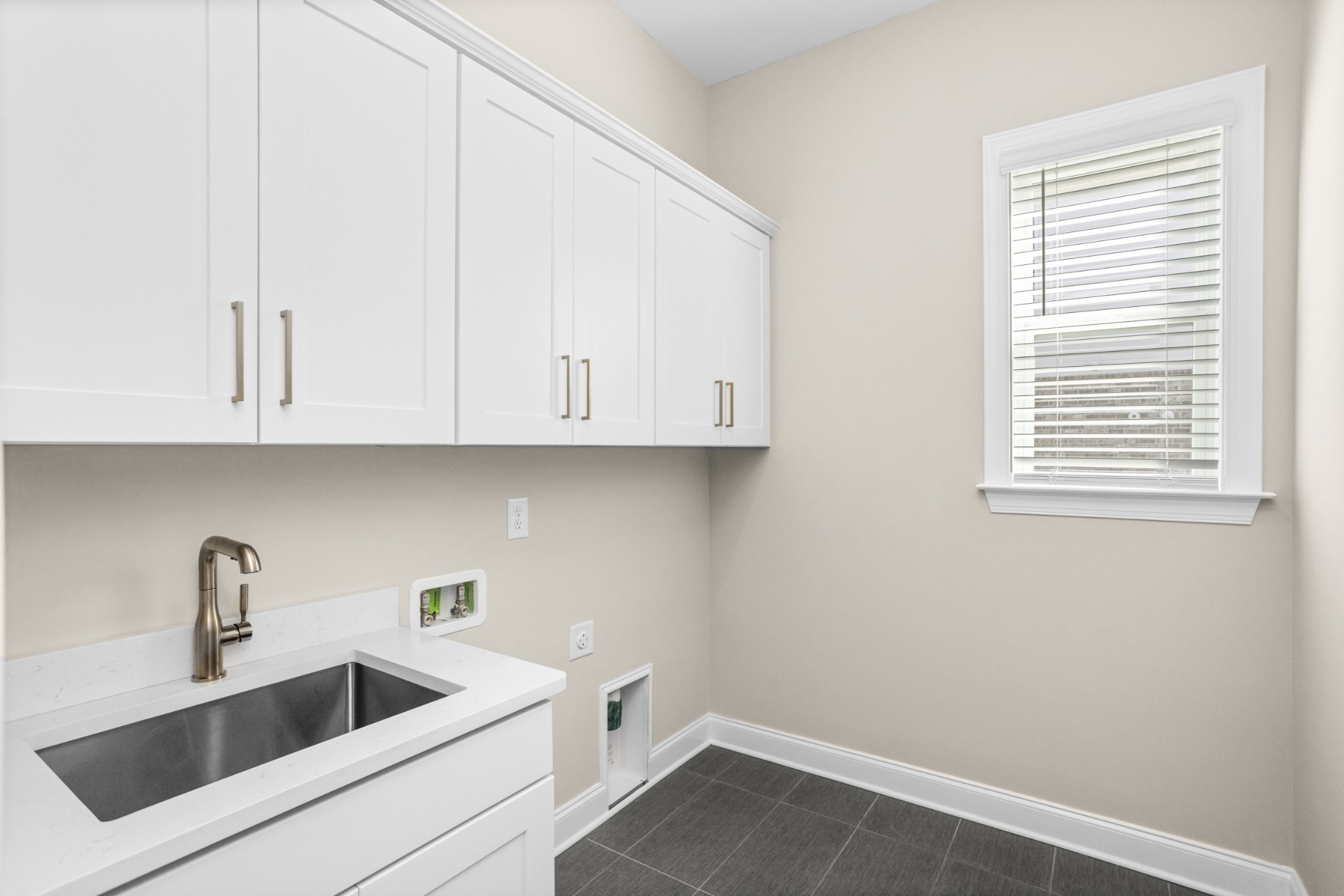 5955 Hunt Vly Drive Spring Hill, TN 37174 - Photo 32 of 59 a kitchen with a sink and cabinets