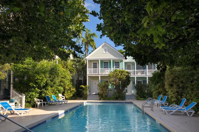 a house with swimming pool in front of it