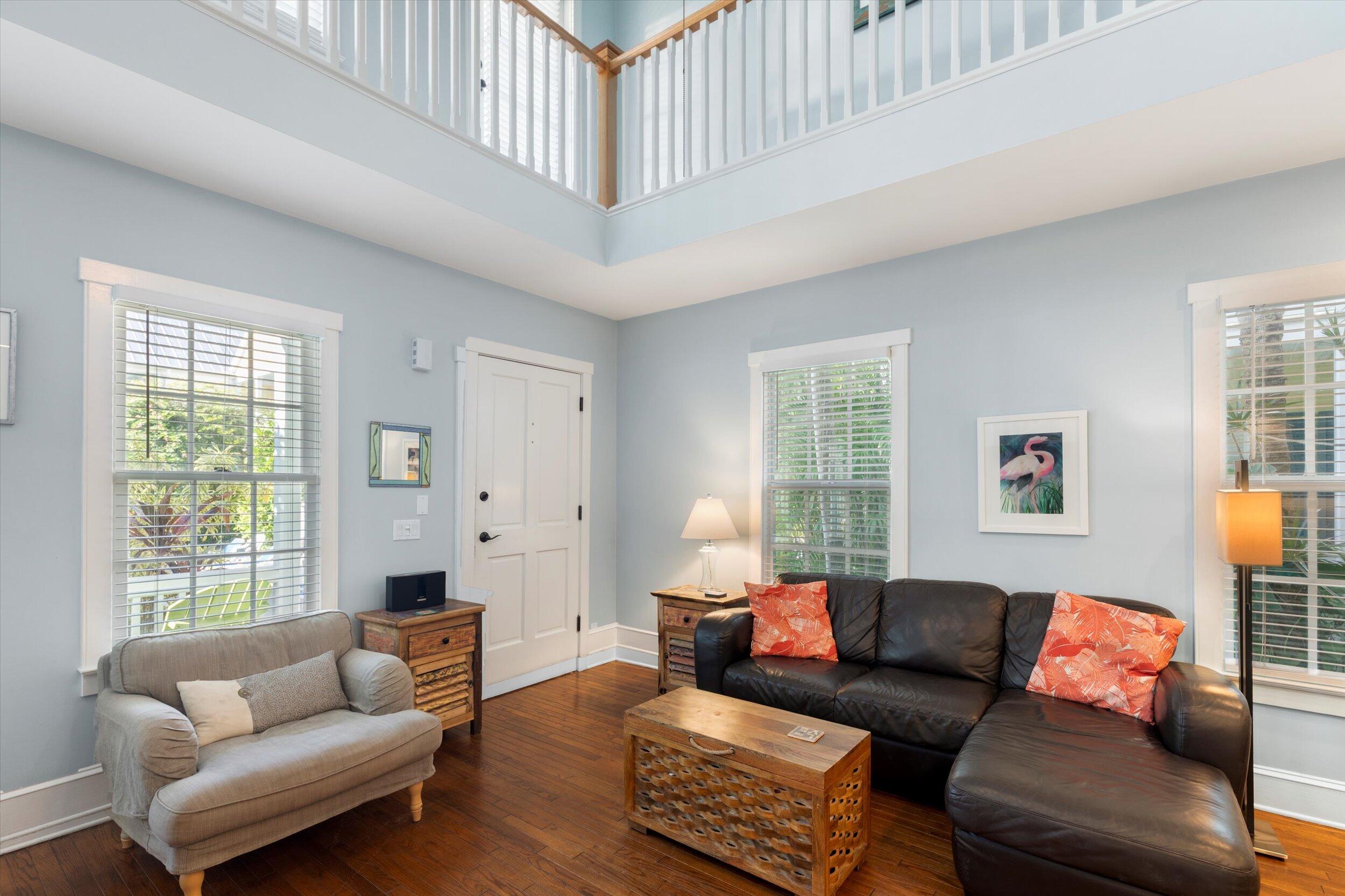 606 Truman Avenue, Unit 7 Key West, FL 33040 - Photo 16 of 49 a living room with furniture and a window
