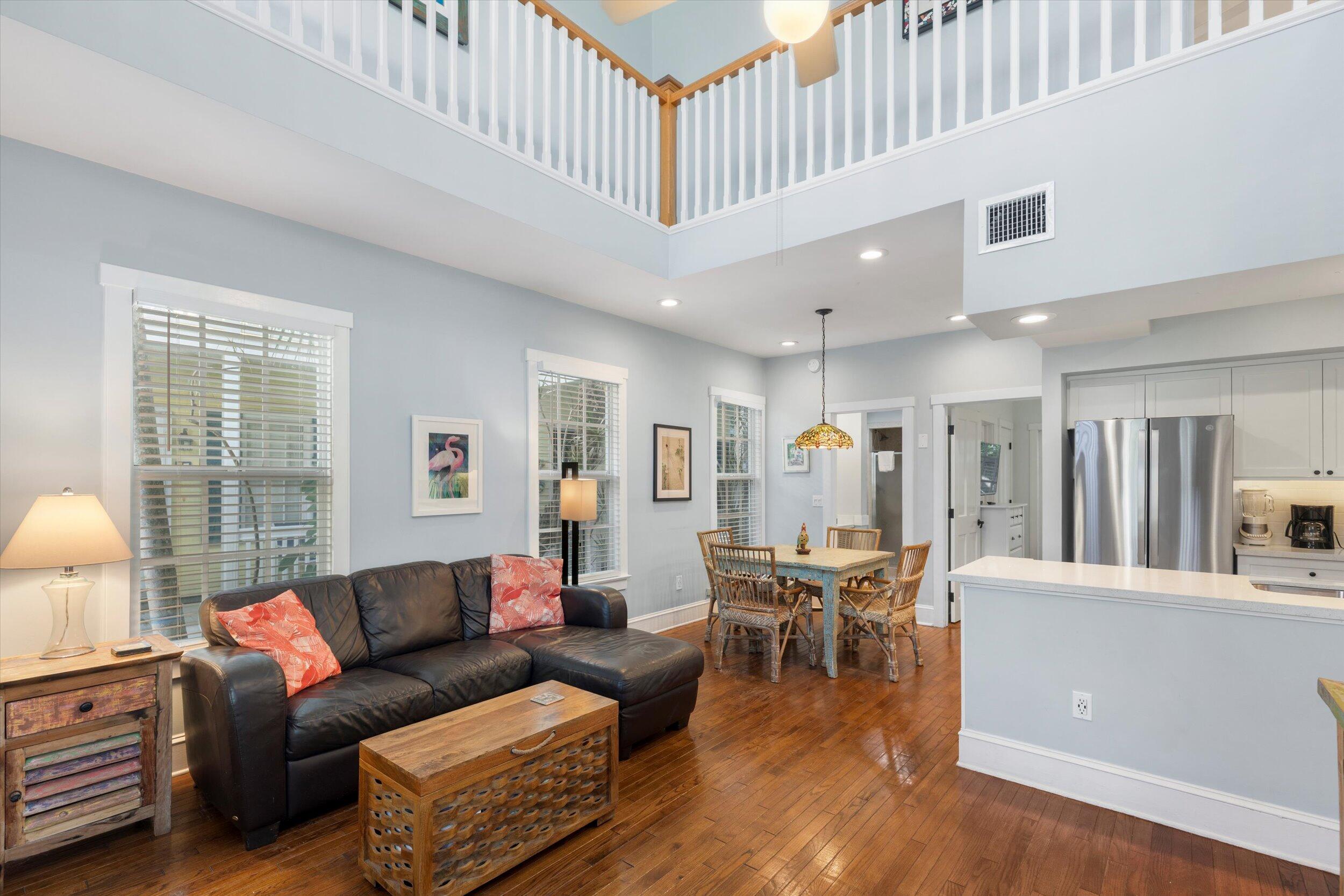 606 Truman Avenue, Unit 7 Key West, FL 33040 - Photo 19 of 49 a living room with furniture and a large window