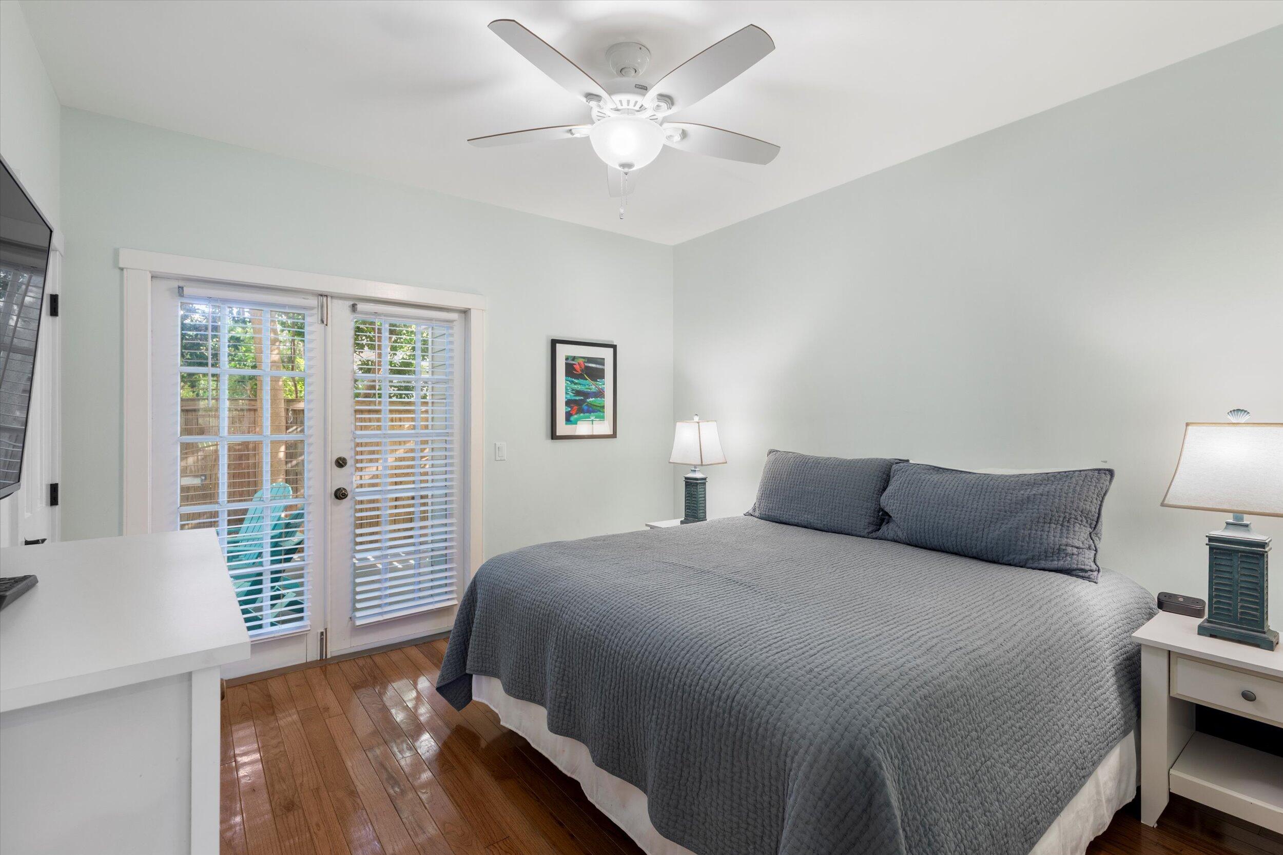 606 Truman Avenue, Unit 7 Key West, FL 33040 - Photo 22 of 49 a bedroom with a large bed and a window