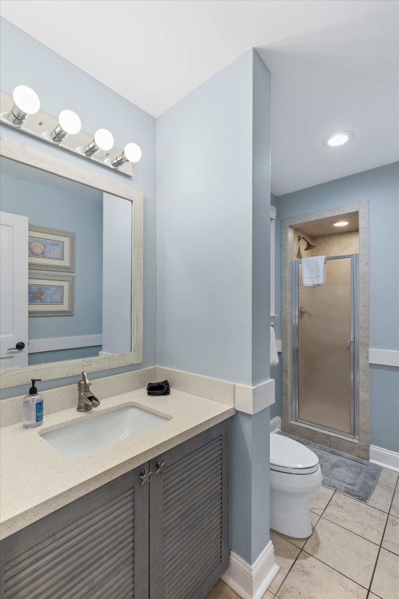 606 Truman Avenue, Unit 7 Key West, FL 33040 - Photo 25 of 49 a bathroom with a sink a toilet and shower