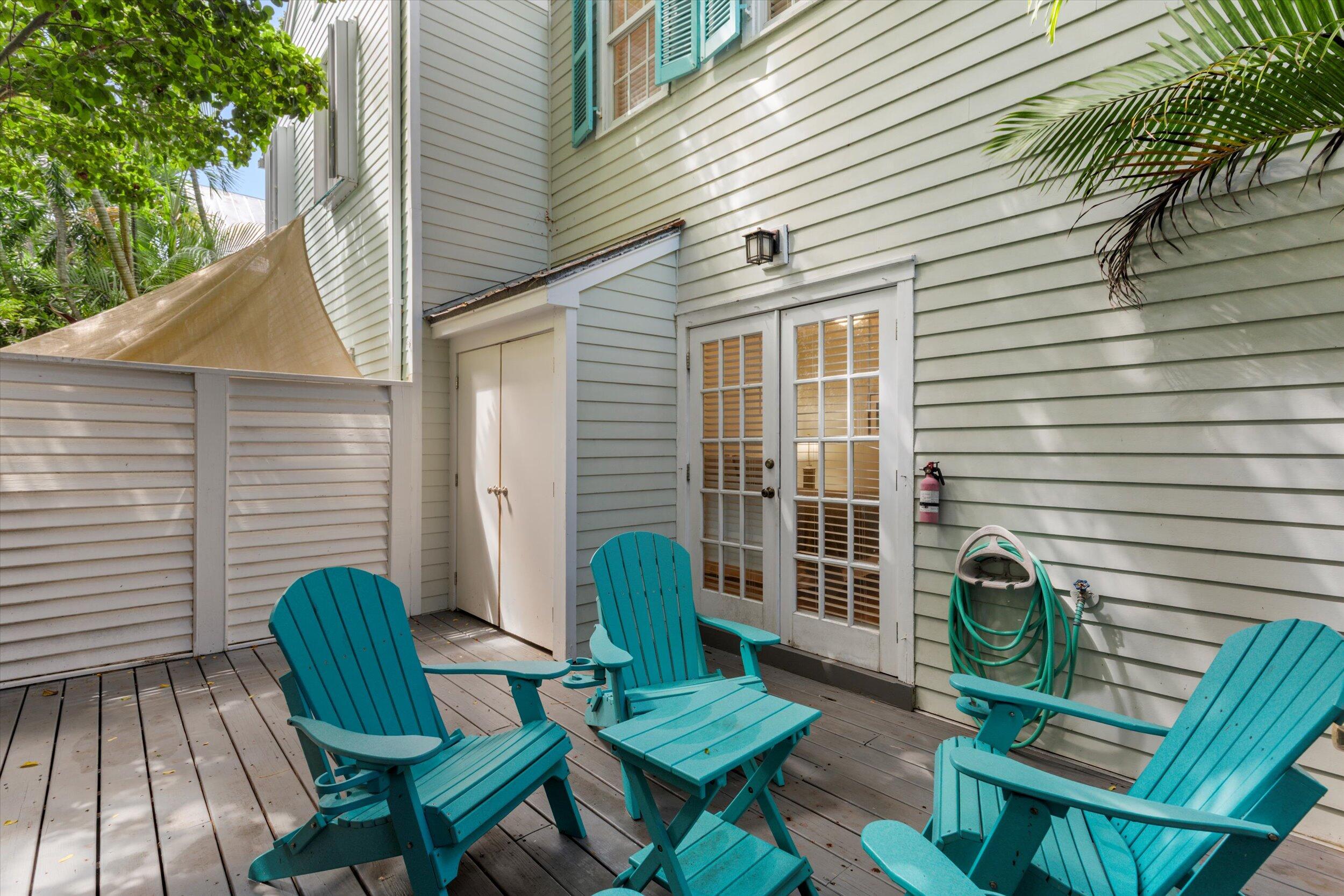 606 Truman Avenue, Unit 7 Key West, FL 33040 - Photo 26 of 49 a view of a chair in a patio