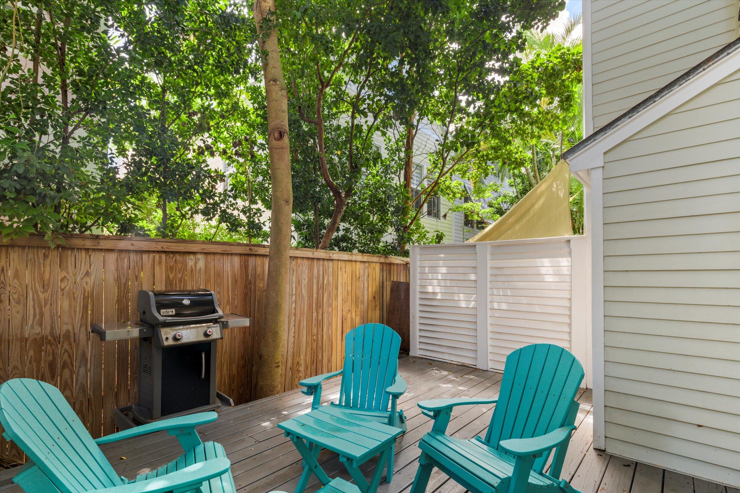 606 Truman Avenue, Unit 7 Key West, FL 33040 - Photo 27 of 49 a view of a chairs in a patio