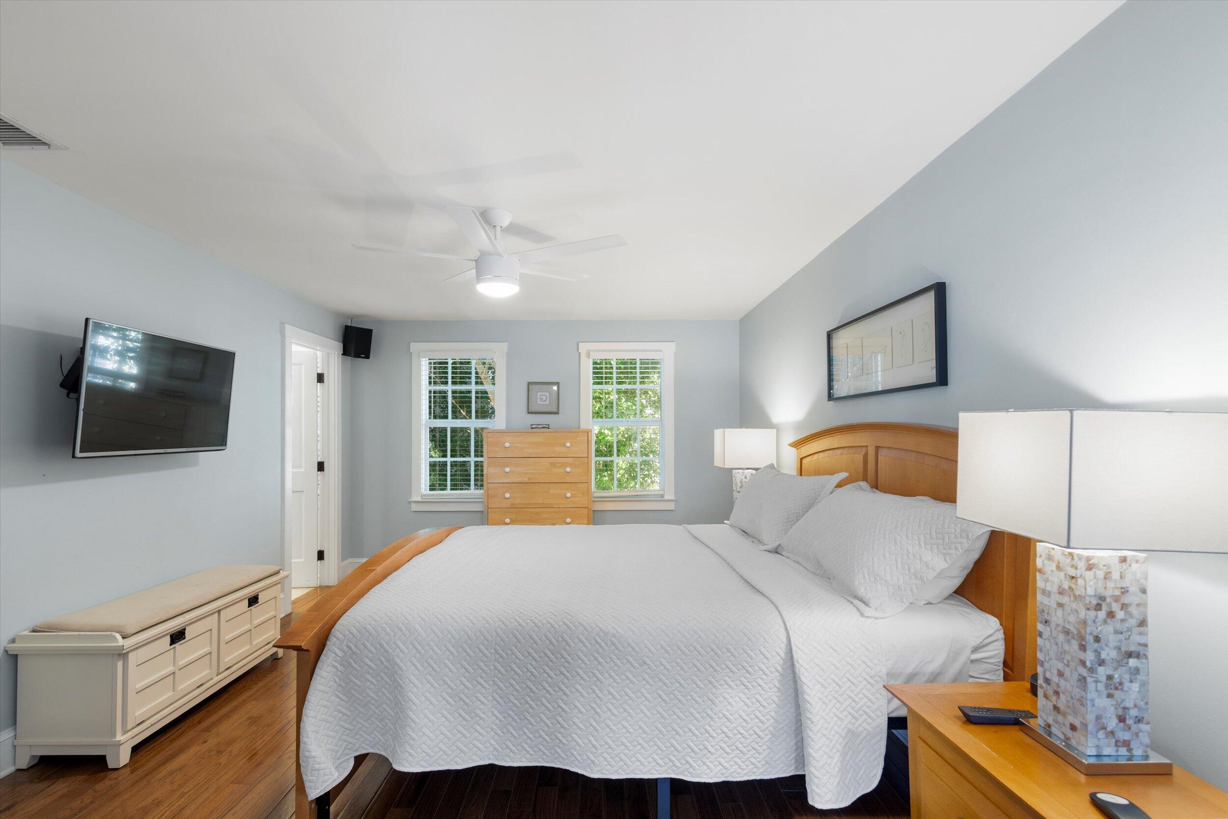 606 Truman Avenue, Unit 7 Key West, FL 33040 - Photo 32 of 49 a bedroom with a bed and a flat screen tv