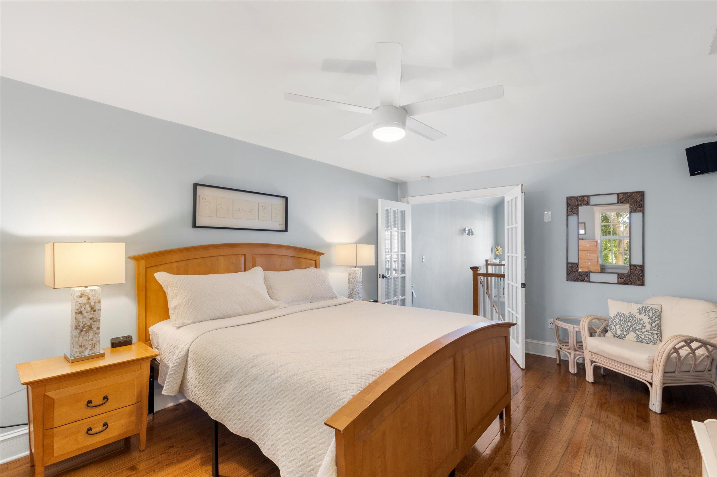 606 Truman Avenue, Unit 7 Key West, FL 33040 - Photo 34 of 49 a bedroom with a bed and a couch