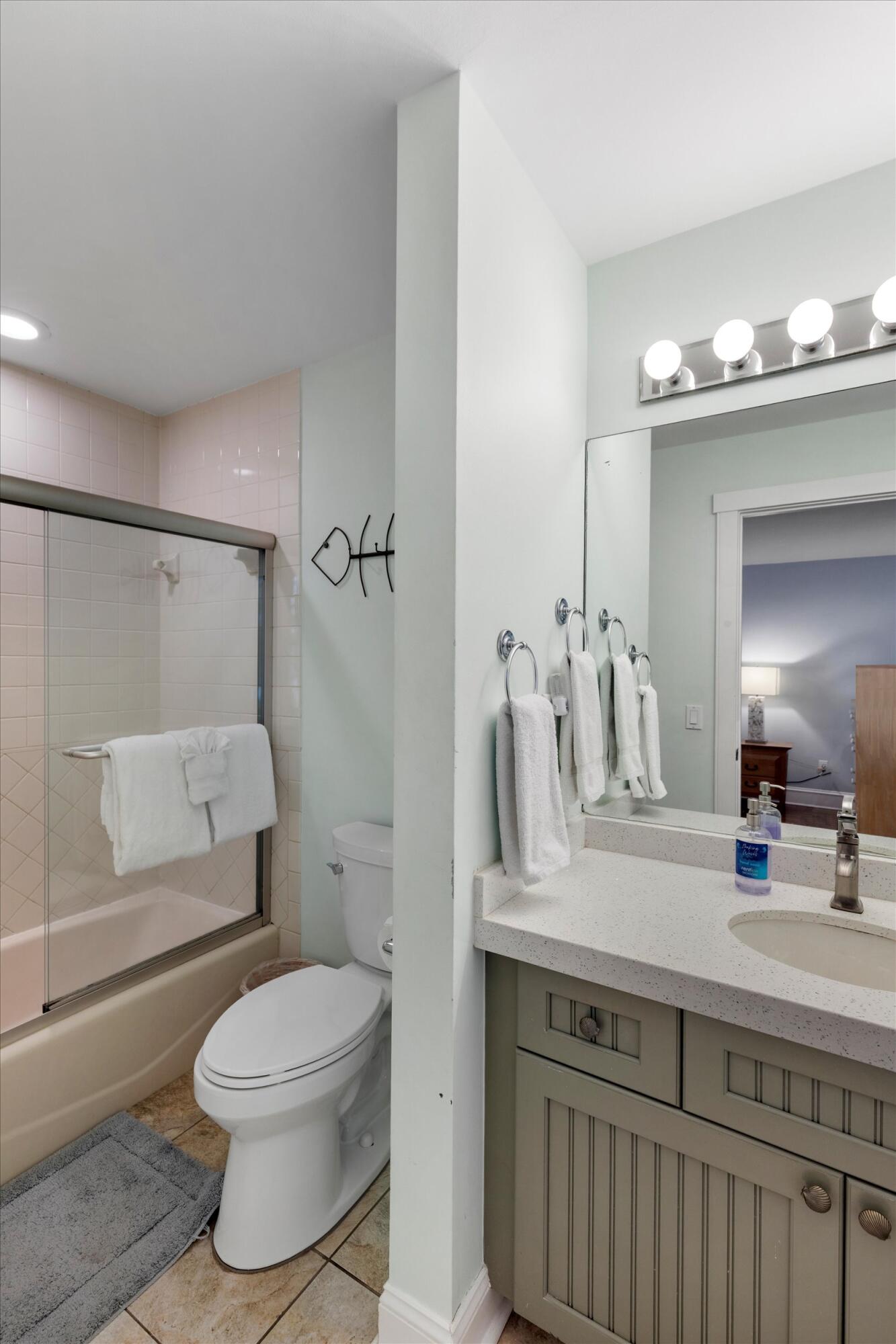 606 Truman Avenue, Unit 7 Key West, FL 33040 - Photo 35 of 49 a bathroom with a sink a toilet and shower