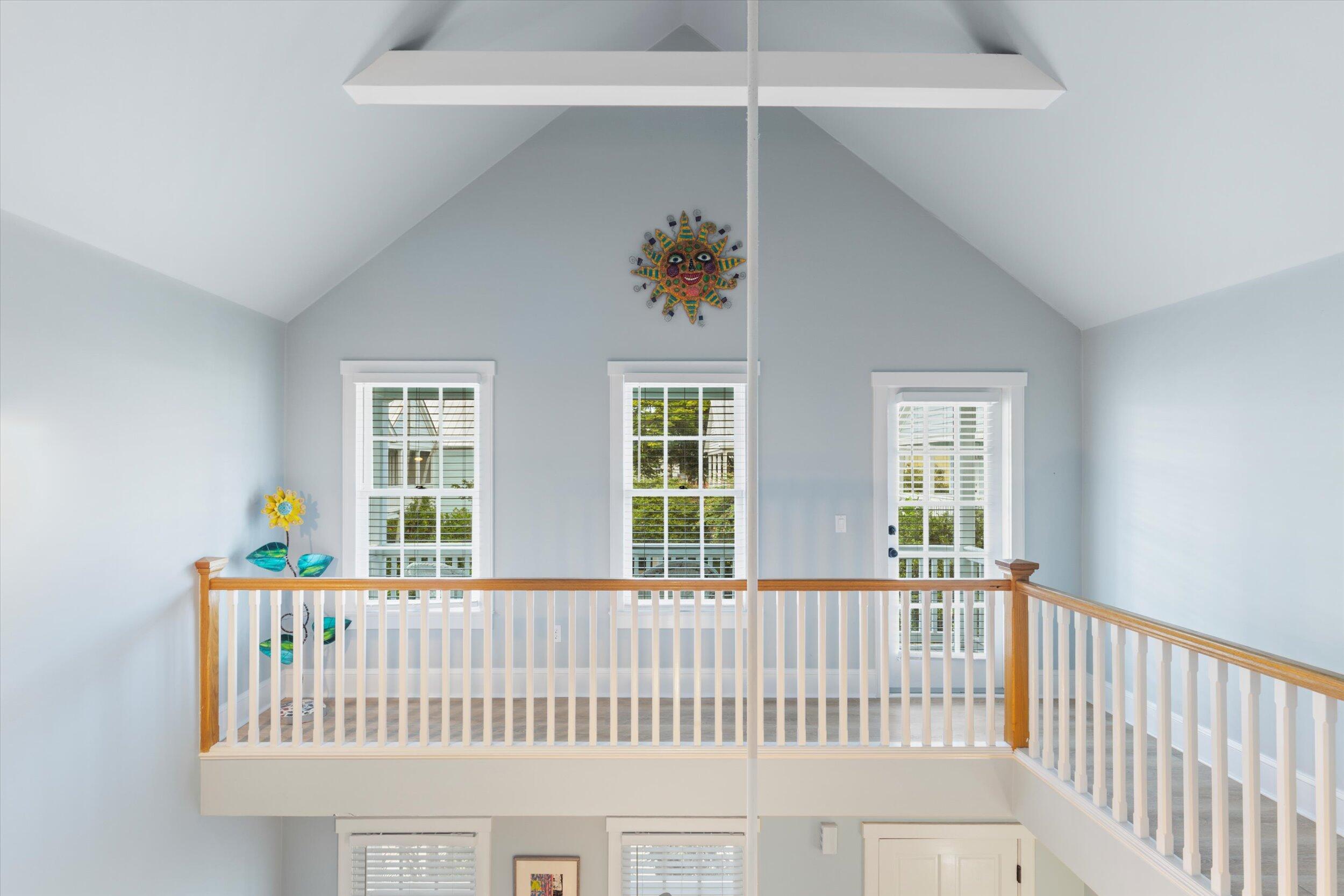 606 Truman Avenue, Unit 7 Key West, FL 33040 - Photo 38 of 49 a view of a bedroom with wooden floor & a ceiling fan