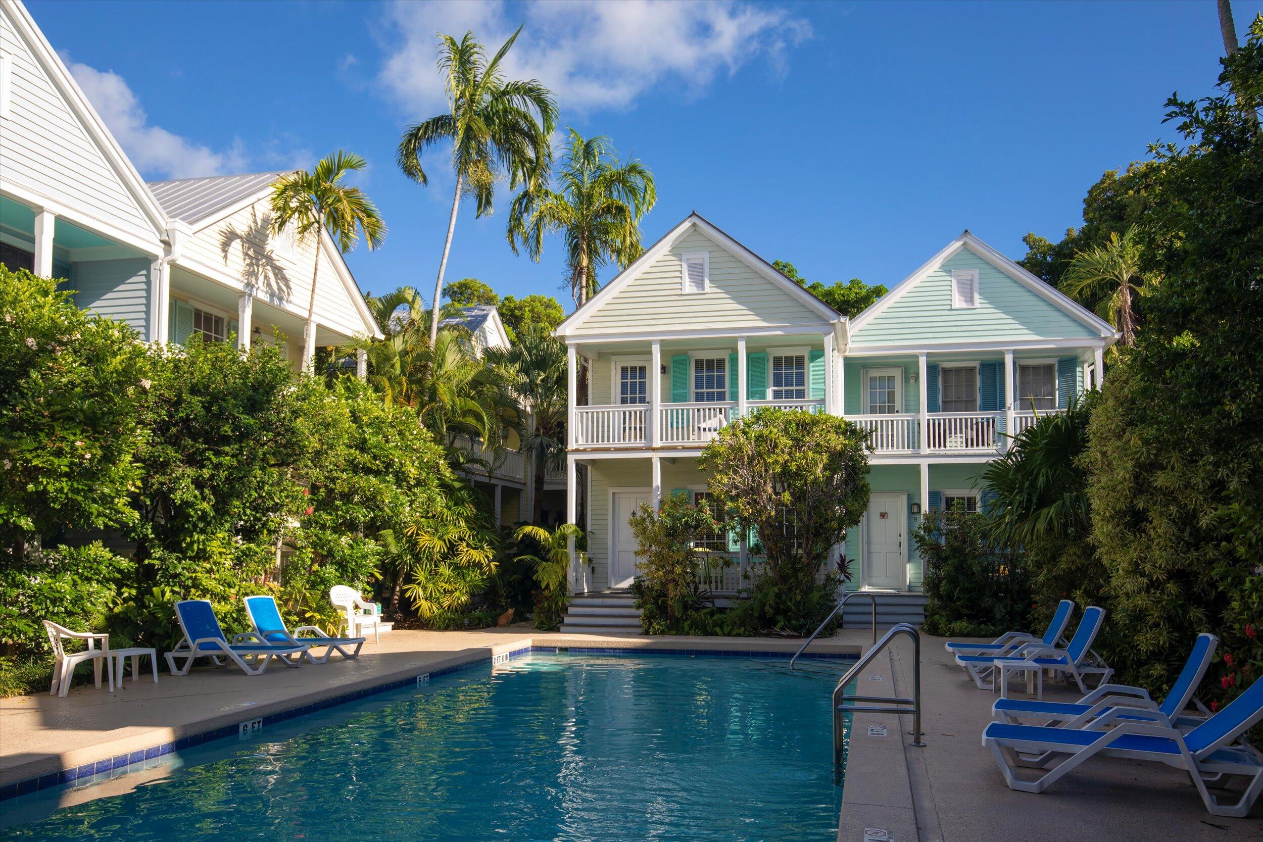 606 Truman Avenue, Unit 7 Key West, FL 33040 - Photo 43 of 49 a front view of a house with garden
