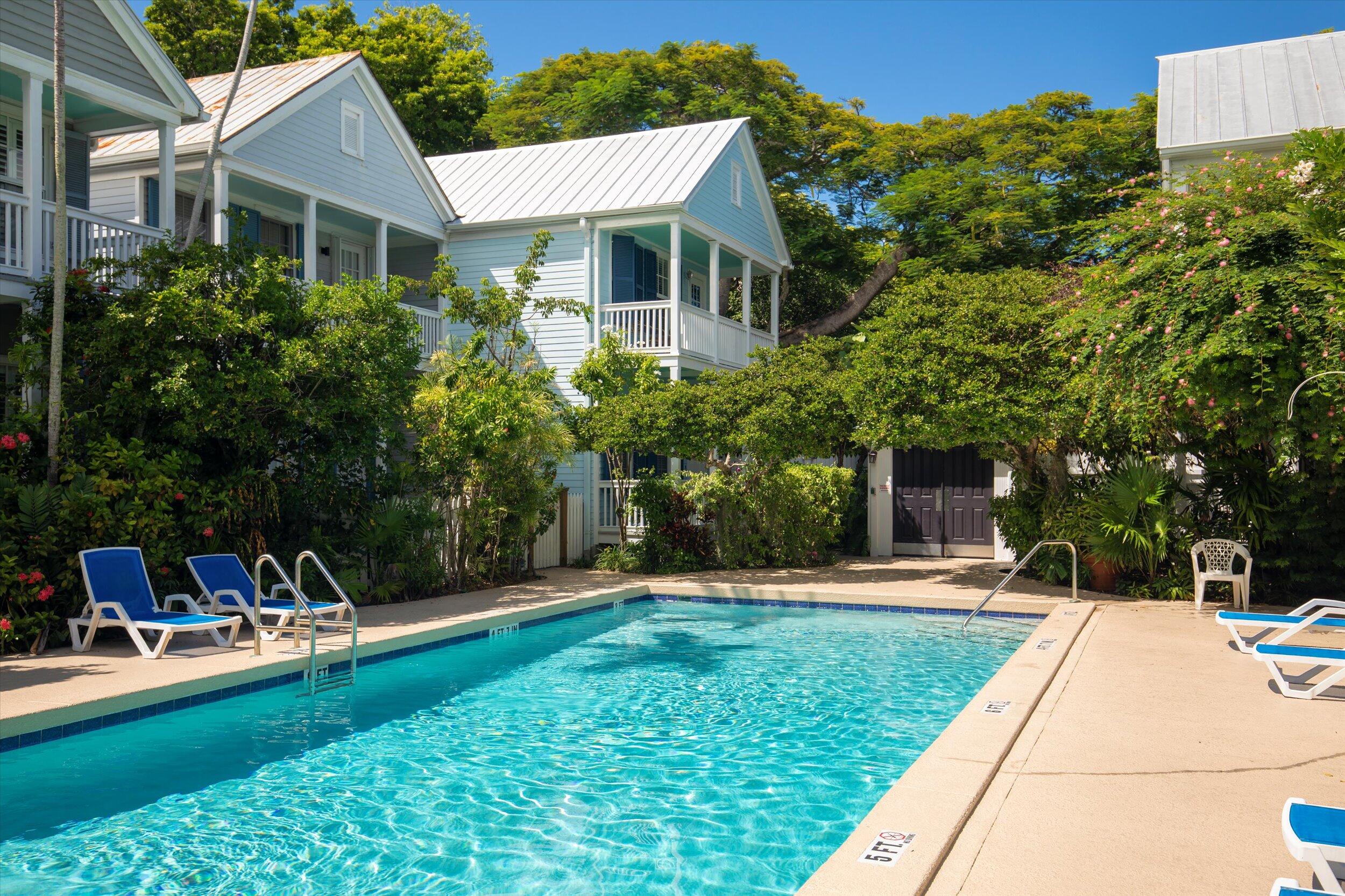 606 Truman Avenue, Unit 7 Key West, FL 33040 - Photo 45 of 49 a front view of a house with a yard