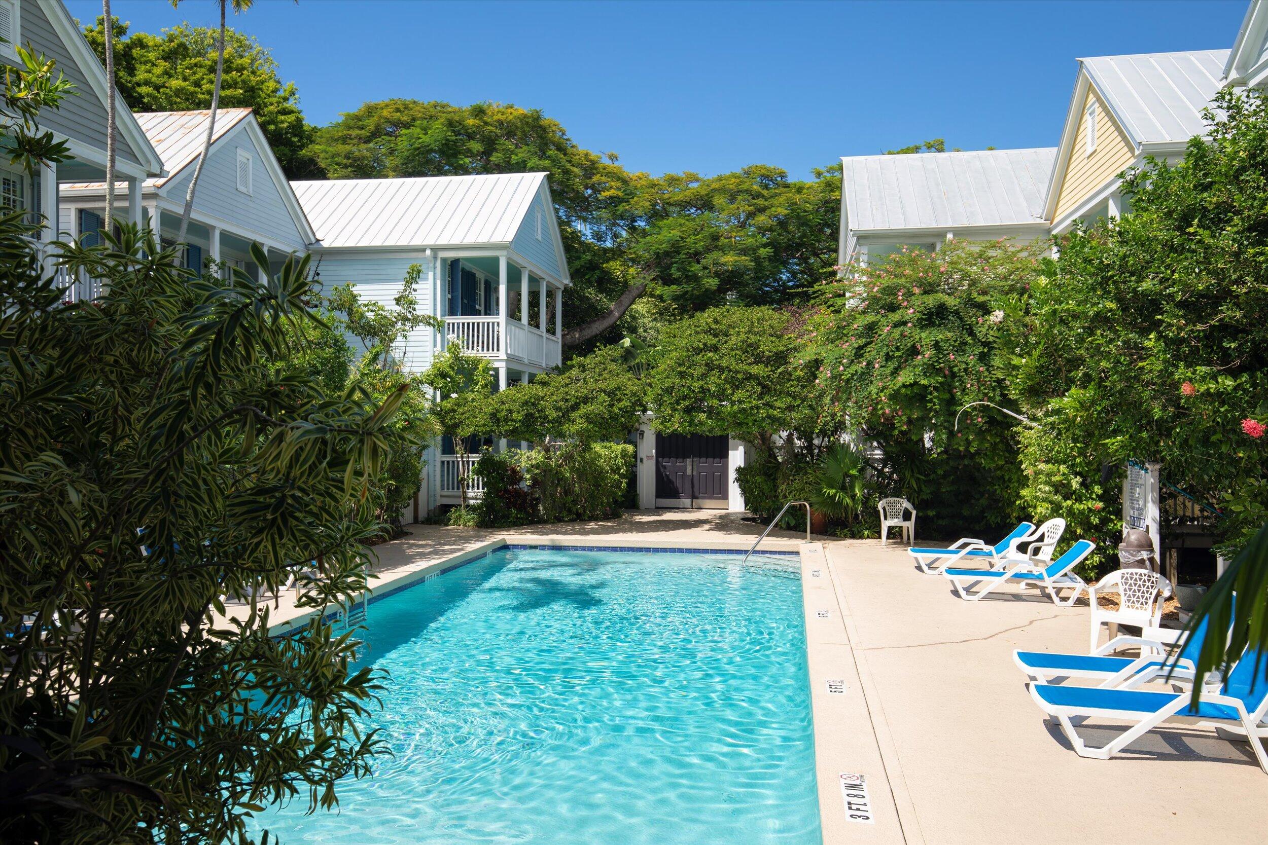 606 Truman Avenue, Unit 7 Key West, FL 33040 - Photo 47 of 49 a view of a house with a yard and potted plants