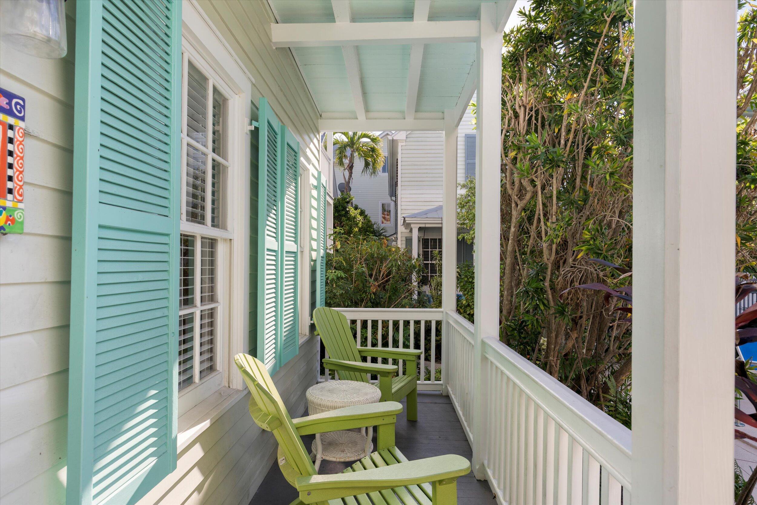 606 Truman Avenue, Unit 7 Key West, FL 33040 - Photo 6 of 49 a view of a balcony with furniture