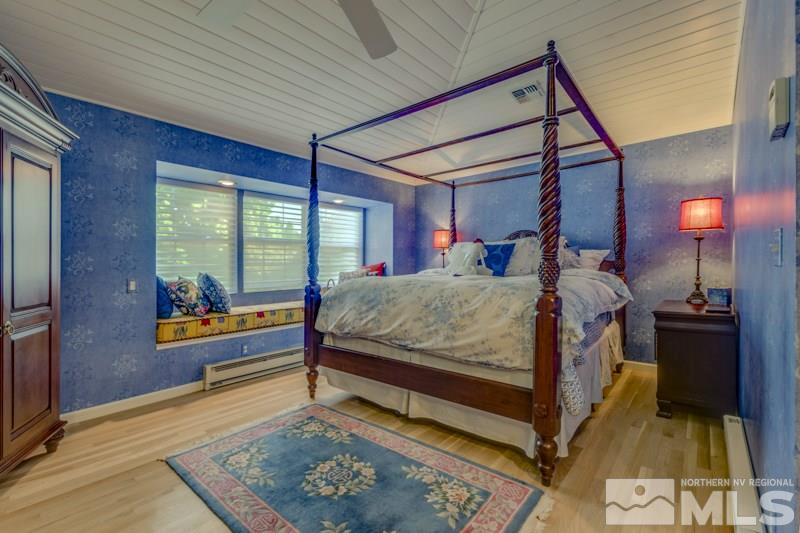 572 Ridge Street Reno, NV 89501 - Photo 19 of 25 a bed room with a bed and a window
