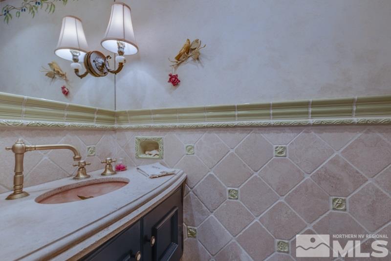 572 Ridge Street Reno, NV 89501 - Photo 5 of 25 a bathroom with a sink and a mirror