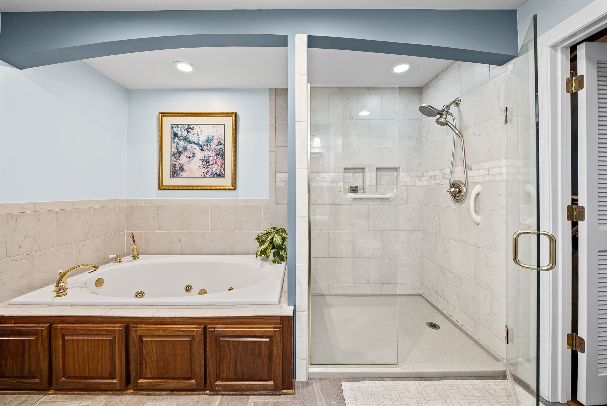 2419 Williams Hollow Road McEwen, TN 37101 - Photo 24 of 85 a bathroom with a bathtub and a shower