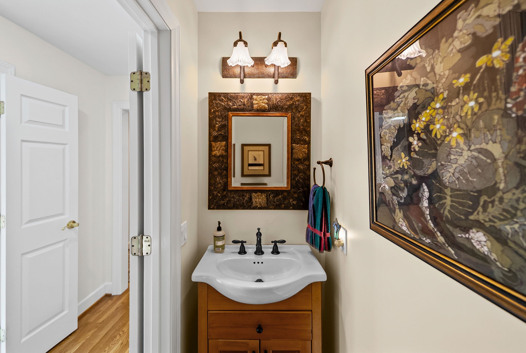 2419 Williams Hollow Road McEwen, TN 37101 - Photo 28 of 85 a bathroom with a sink and a mirror with a vanity