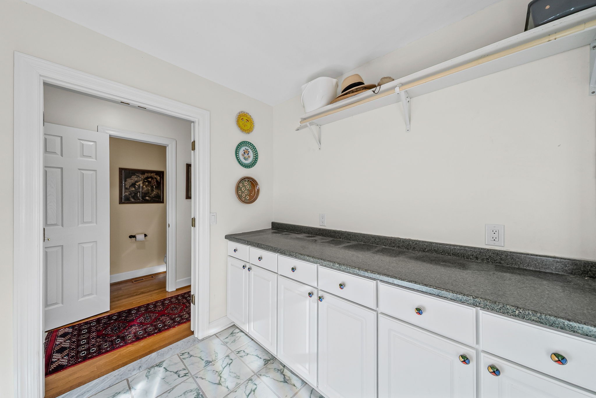 2419 Williams Hollow Road McEwen, TN 37101 - Photo 30 of 85 a spacious bathroom with a granite countertop sink and a mirror