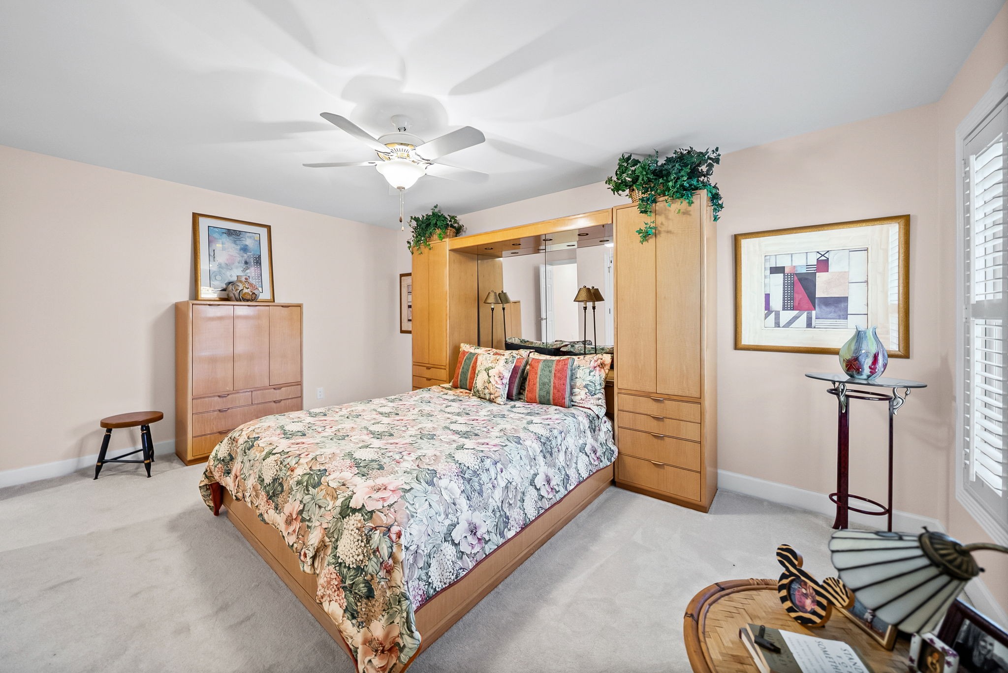 2419 Williams Hollow Road McEwen, TN 37101 - Photo 39 of 85 a bedroom with a bed and dresser with wooden floor