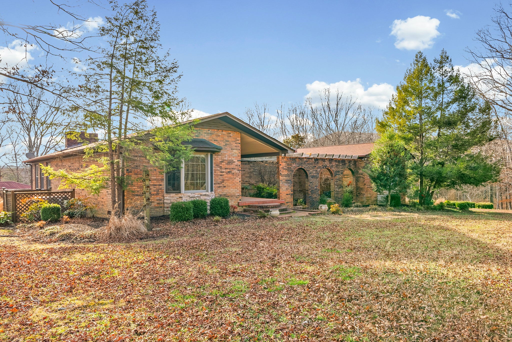 2419 Williams Hollow Road McEwen, TN 37101 - Photo 4 of 85 a front view of a house with garden