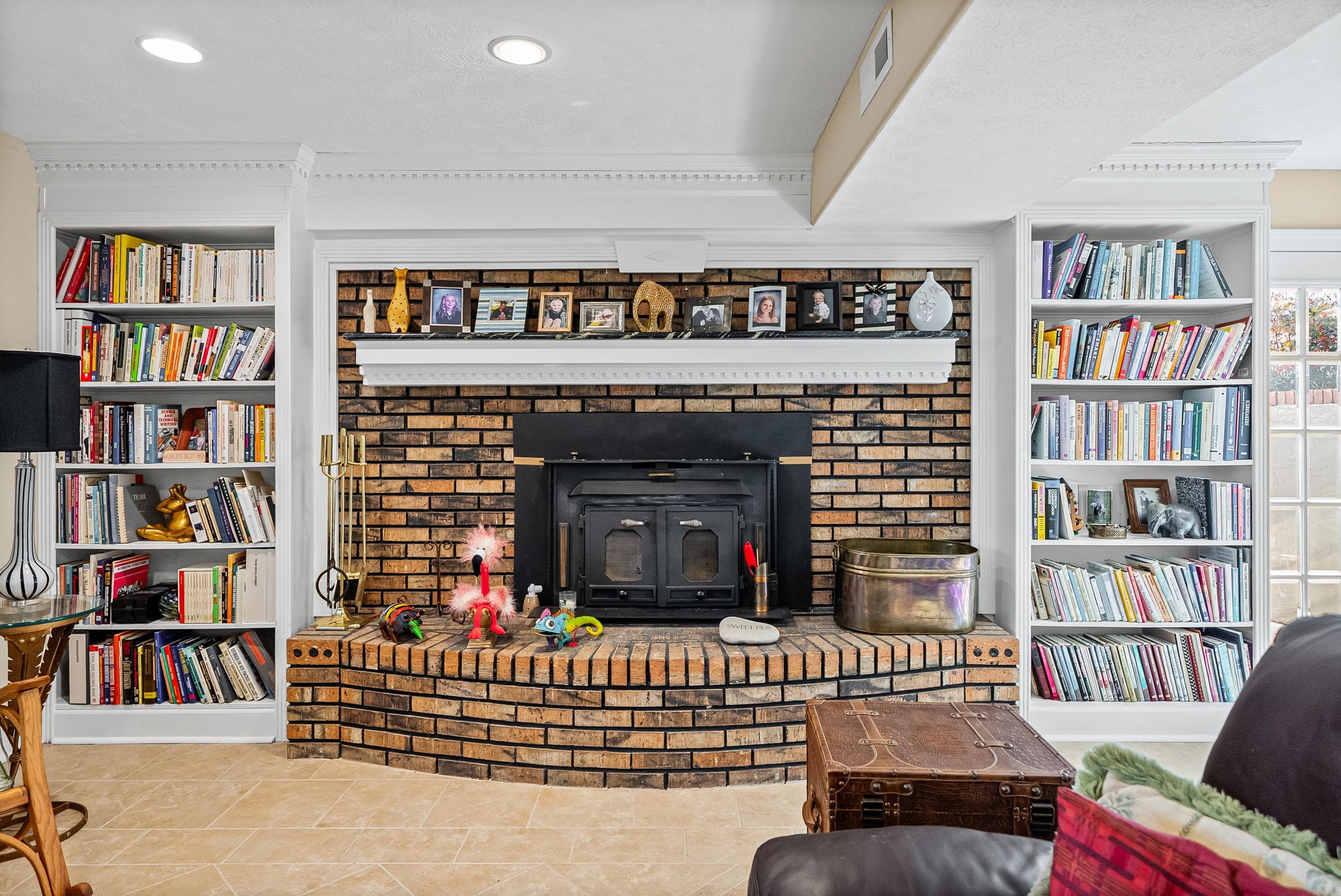 2419 Williams Hollow Road McEwen, TN 37101 - Photo 47 of 85 a living room with a bookshelf and a fireplace