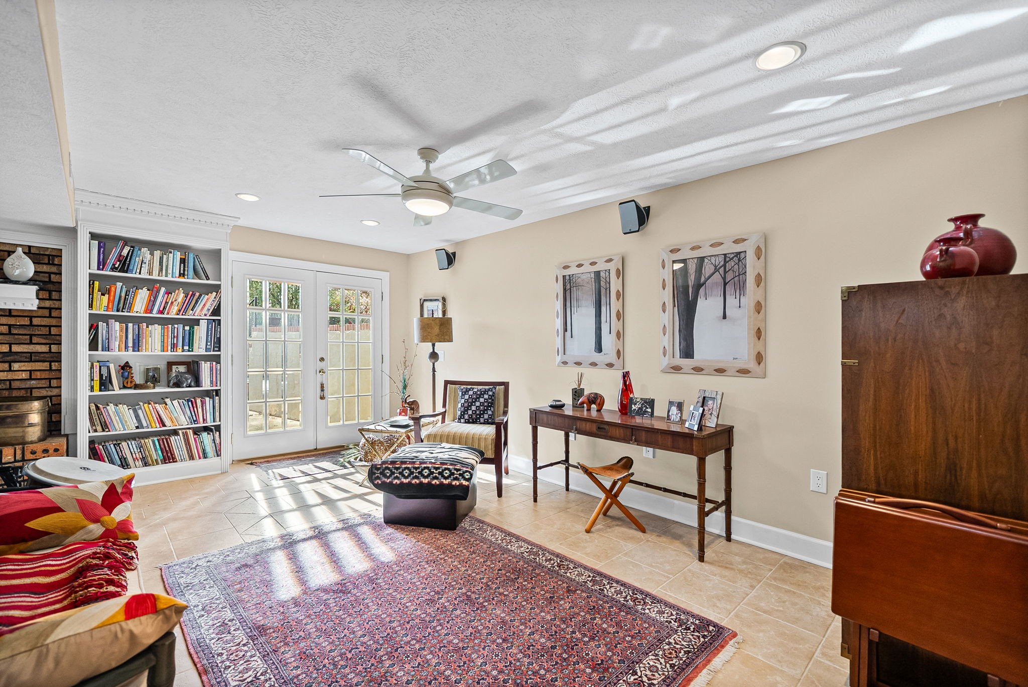 2419 Williams Hollow Road McEwen, TN 37101 - Photo 48 of 85 a living room with furniture a rug and a book shelf