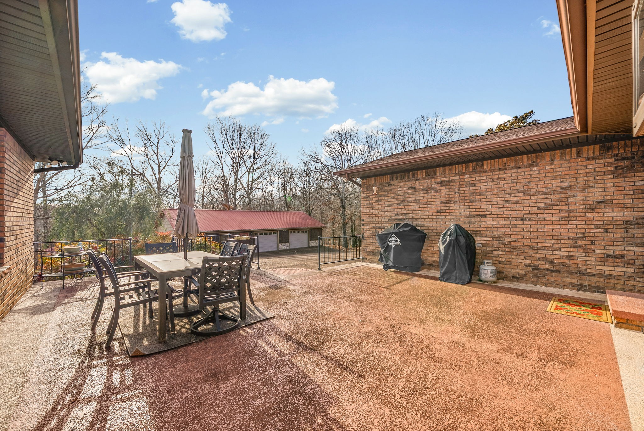 2419 Williams Hollow Road McEwen, TN 37101 - Photo 51 of 85 a view of a patio with table and chairs with wooden floor and fence