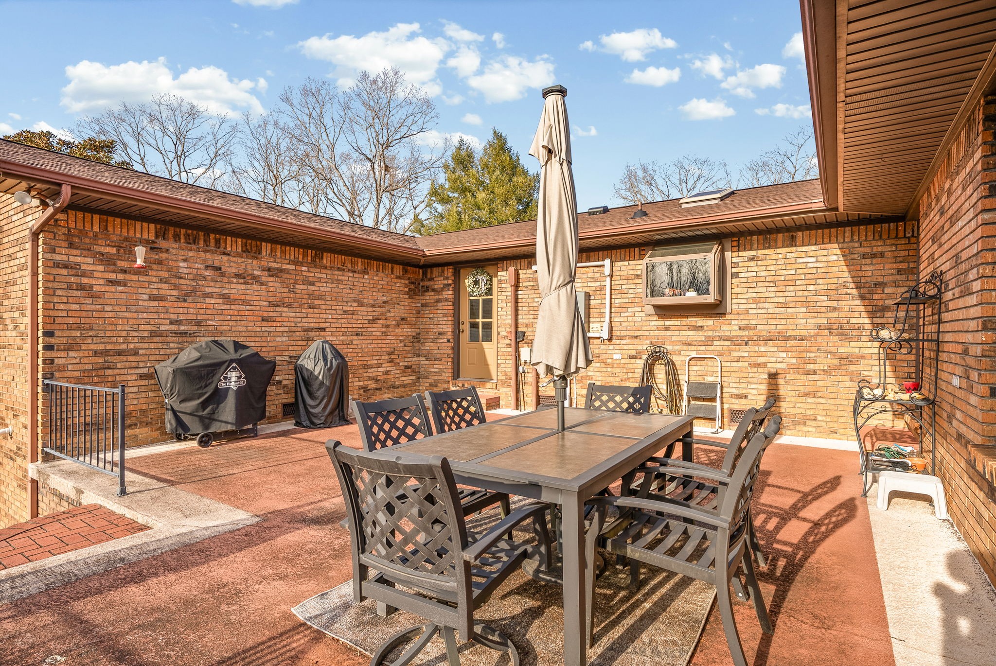 2419 Williams Hollow Road McEwen, TN 37101 - Photo 52 of 85 a view of a patio with table and chairs and potted plants
