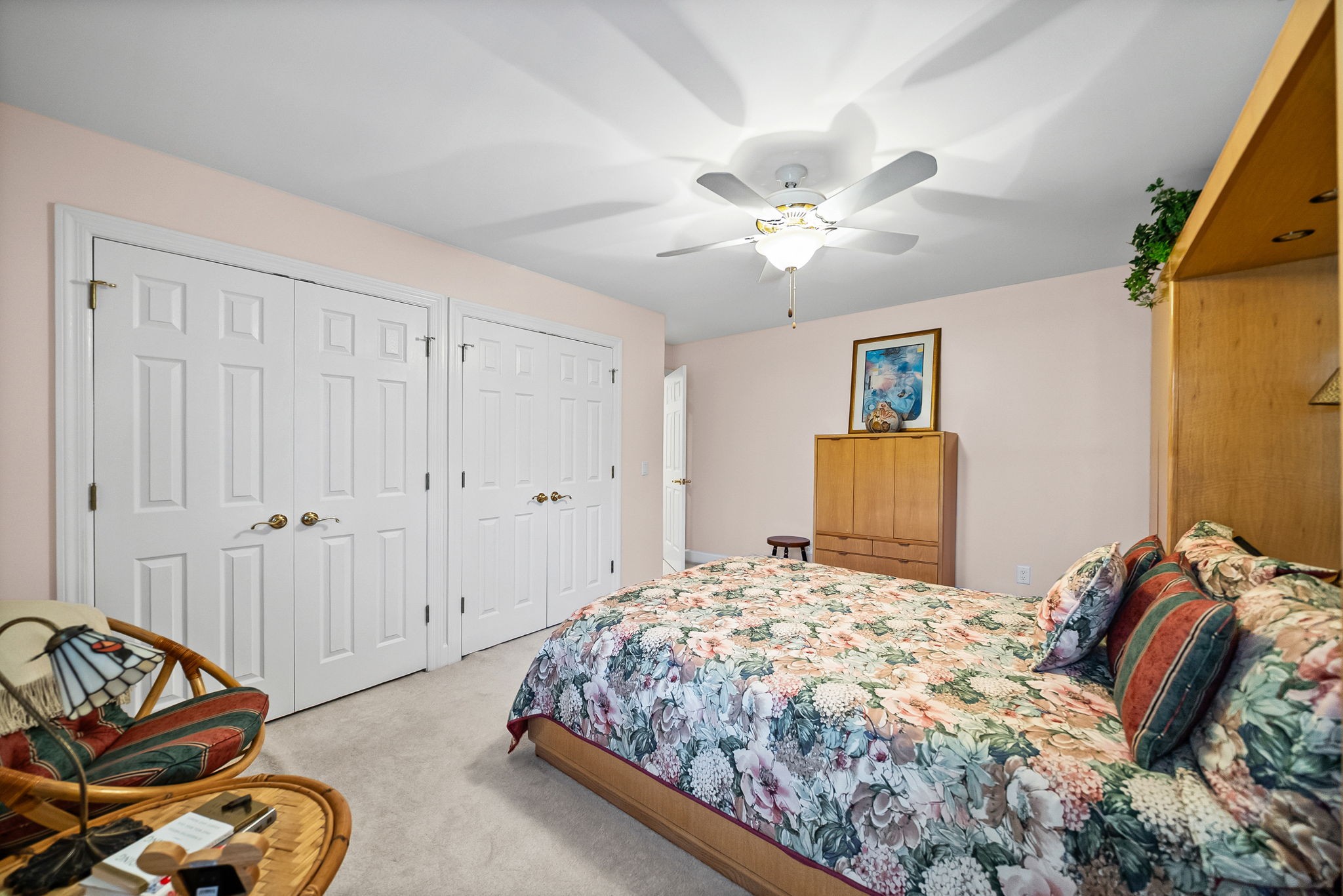 2419 Williams Hollow Road McEwen, TN 37101 - Photo 69 of 85 a bedroom with a bed and a chandelier