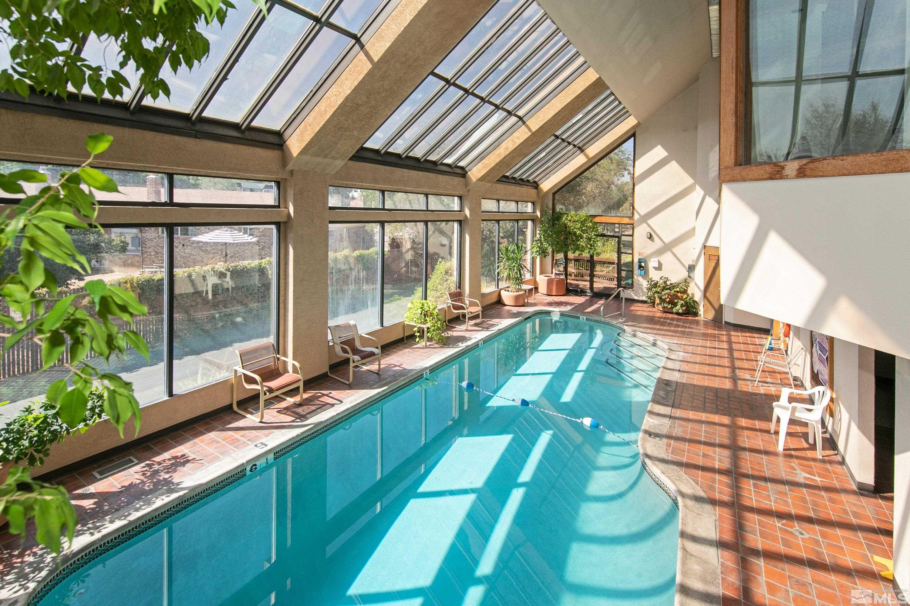 3095 Lakeside Drive, Unit 304 Reno, NV 89509 - Photo 33 of 38 a view of swimming pool with a balcony