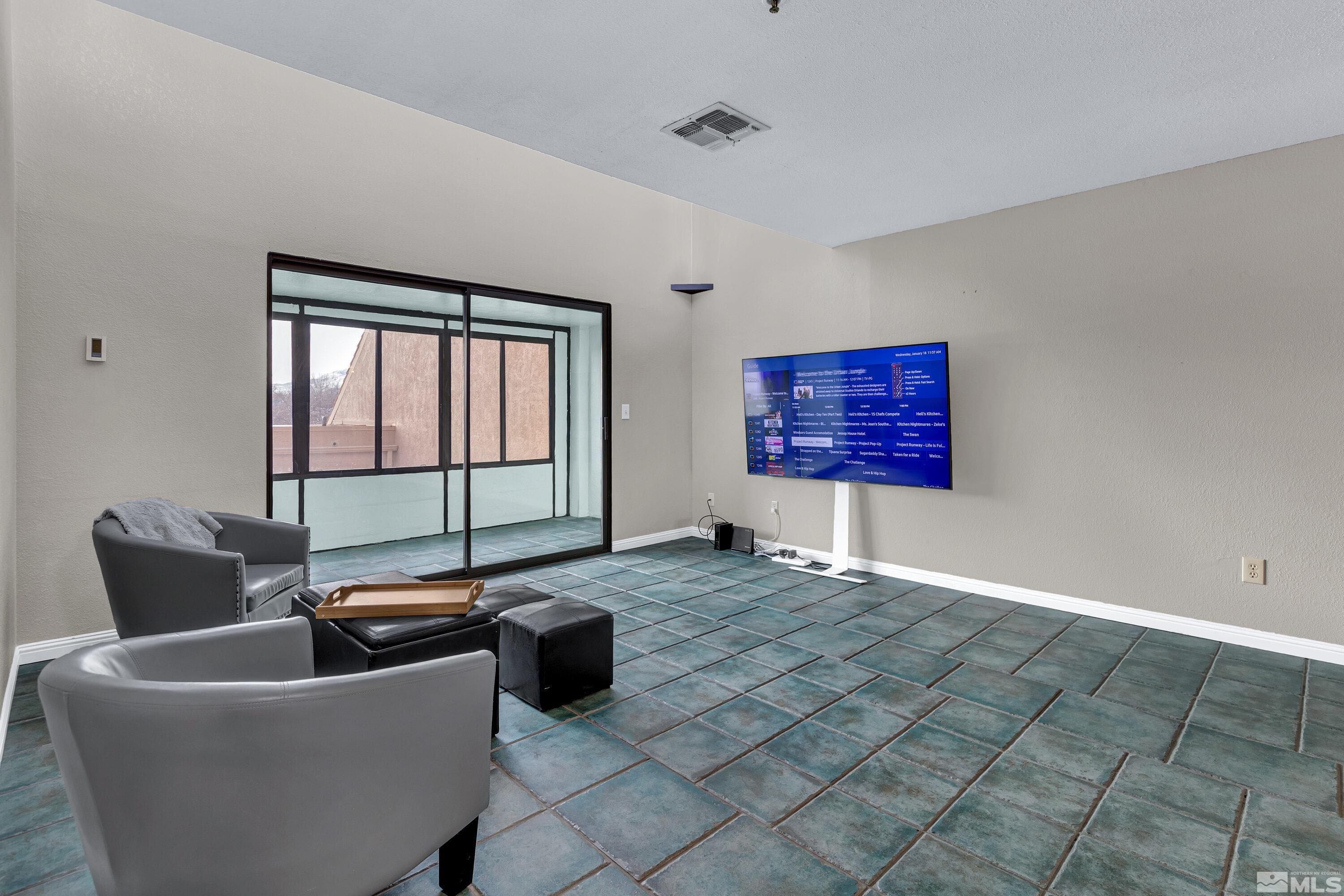 3095 Lakeside Drive, Unit 304 Reno, NV 89509 - Photo 8 of 38 a living room with furniture and window