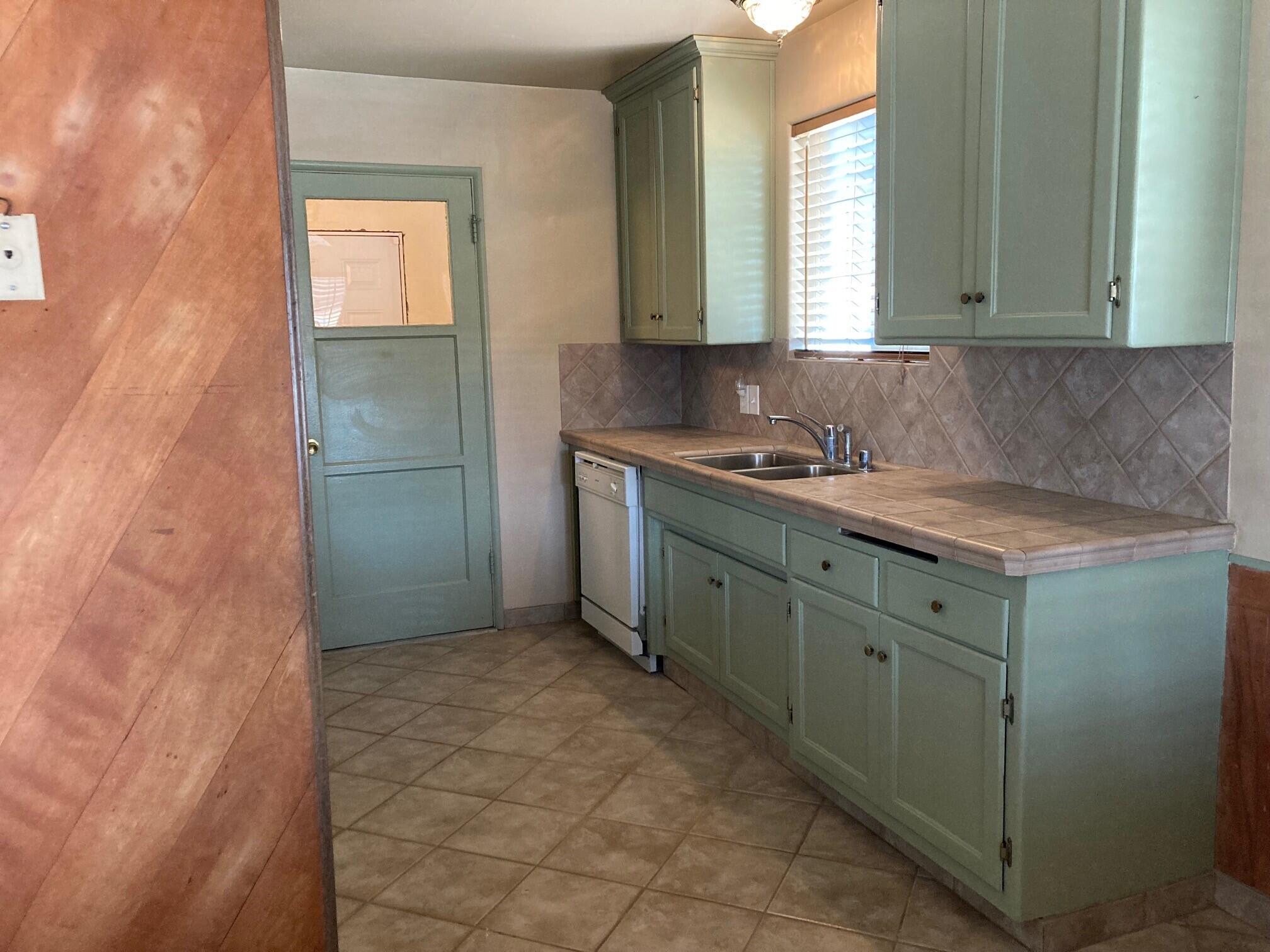 326 East Wilson Street Rialto, CA 92376 - Photo 6 of 19 a bathroom with a sink and a mirror