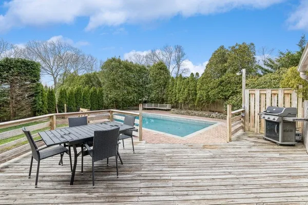 a view of a swimming pool with a patio