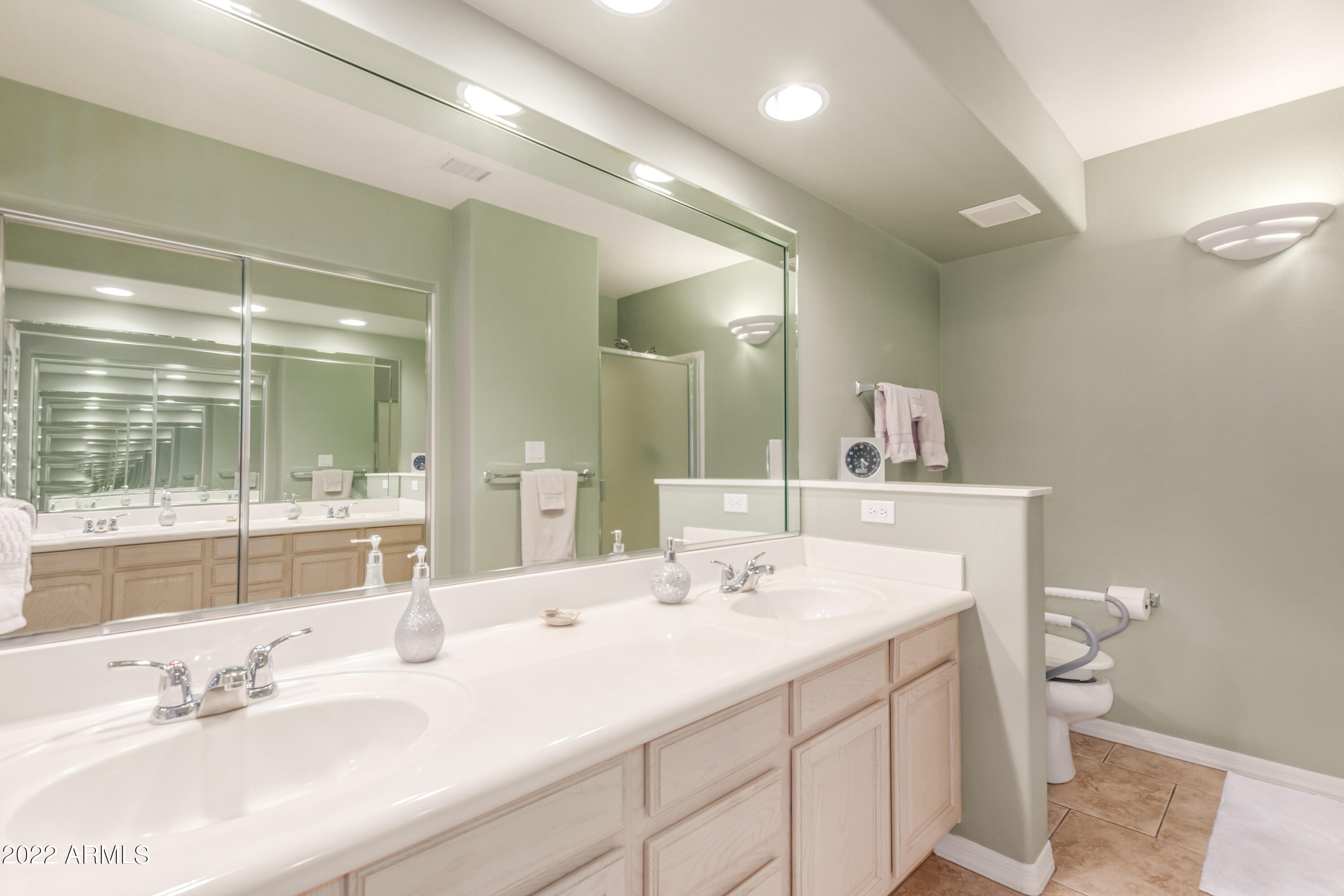 5830 East McKellips Road, Unit 76 Mesa, AZ 85215 - Photo 22 of 33 a bathroom with a sink double vanity and a mirror