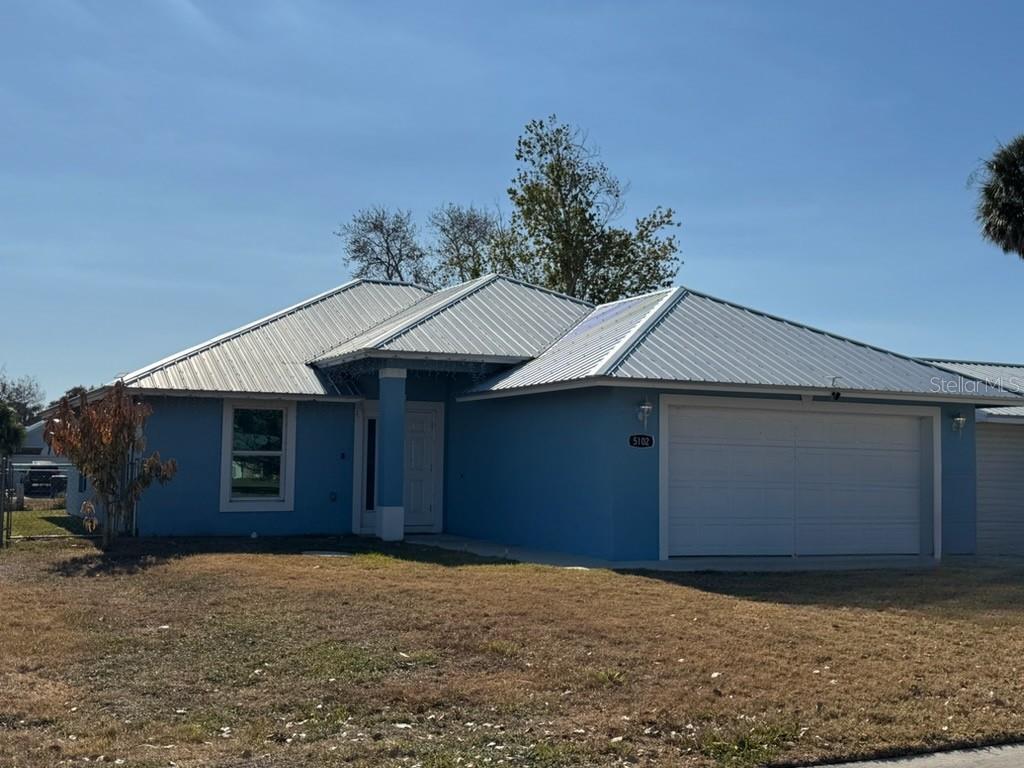 5102 Southeast 43rd Trace Okeechobee, FL 34974 - Photo 2 of 2 a front view of a house
