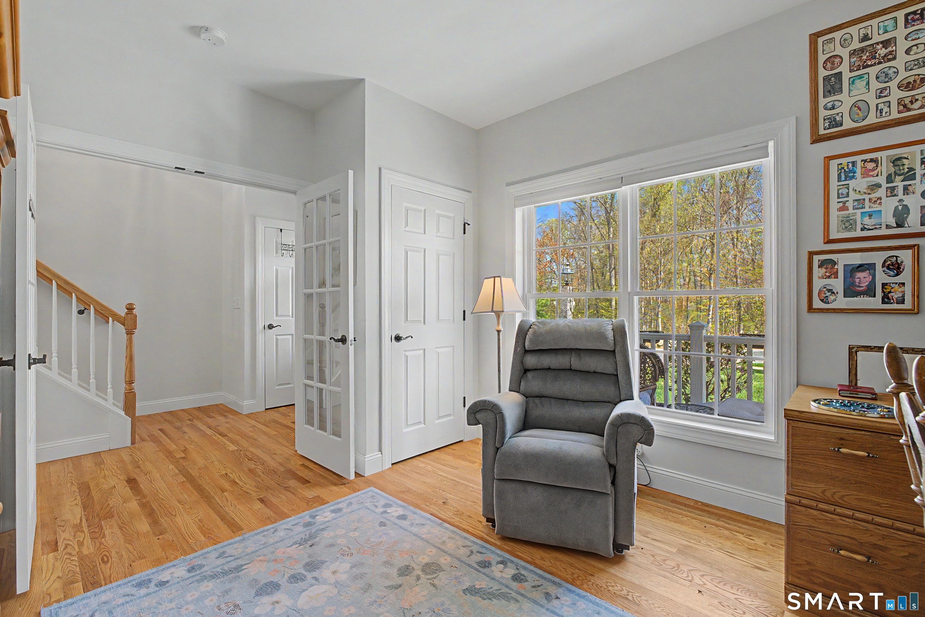 211 Meadowbrook Road, Unit 211 Oxford, CT 06478 - Photo 22 of 38 A third view of the office facing the front porch. Enjoy peaceful views from this bright and adaptable space, perfectly suited for work-from-home needs or additional sleeping quarters.