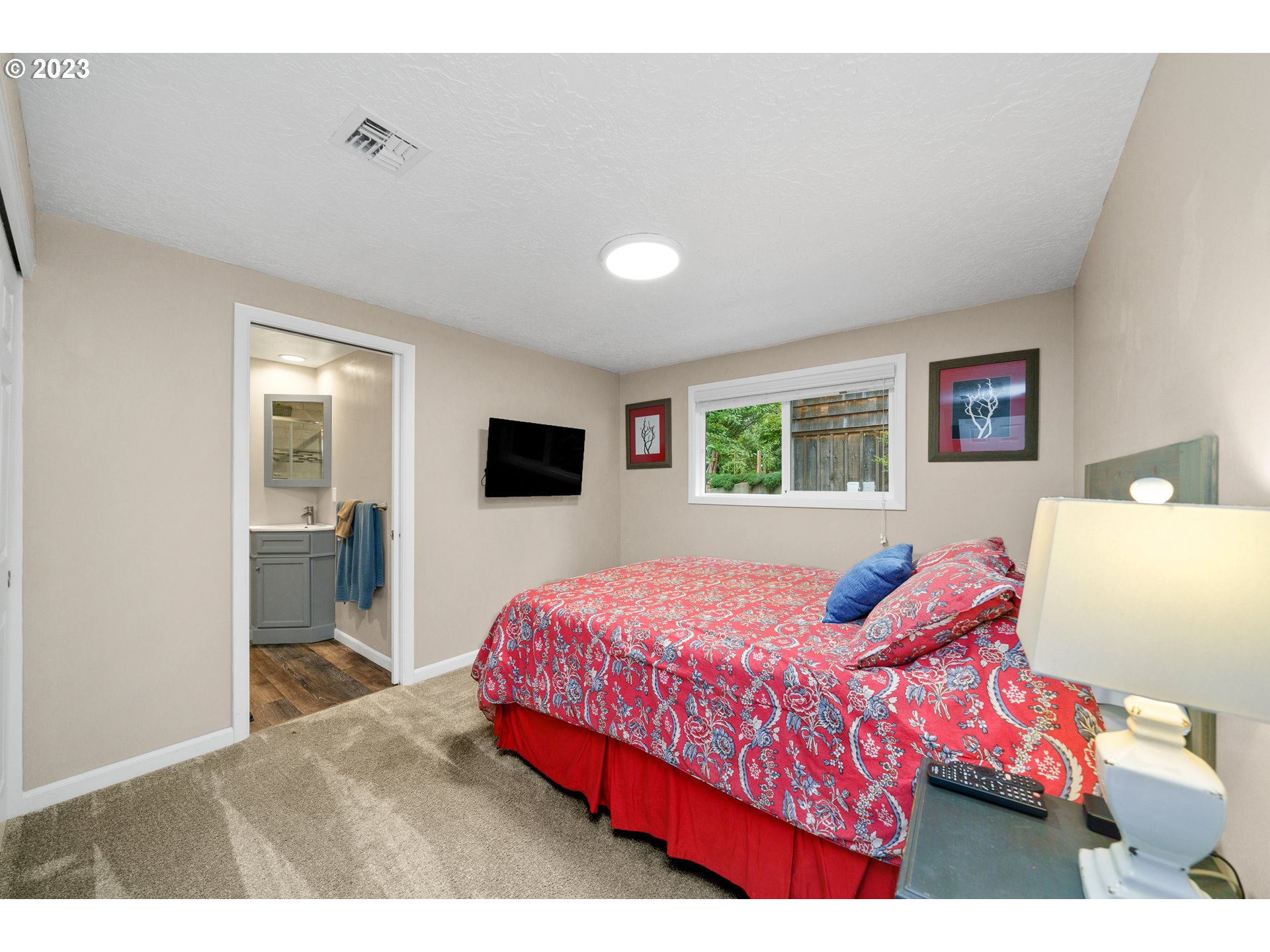 37185 Indian Gap Road Nehalem, OR 97131 - Photo 23 of 33 a bedroom with a bed and a flat screen tv