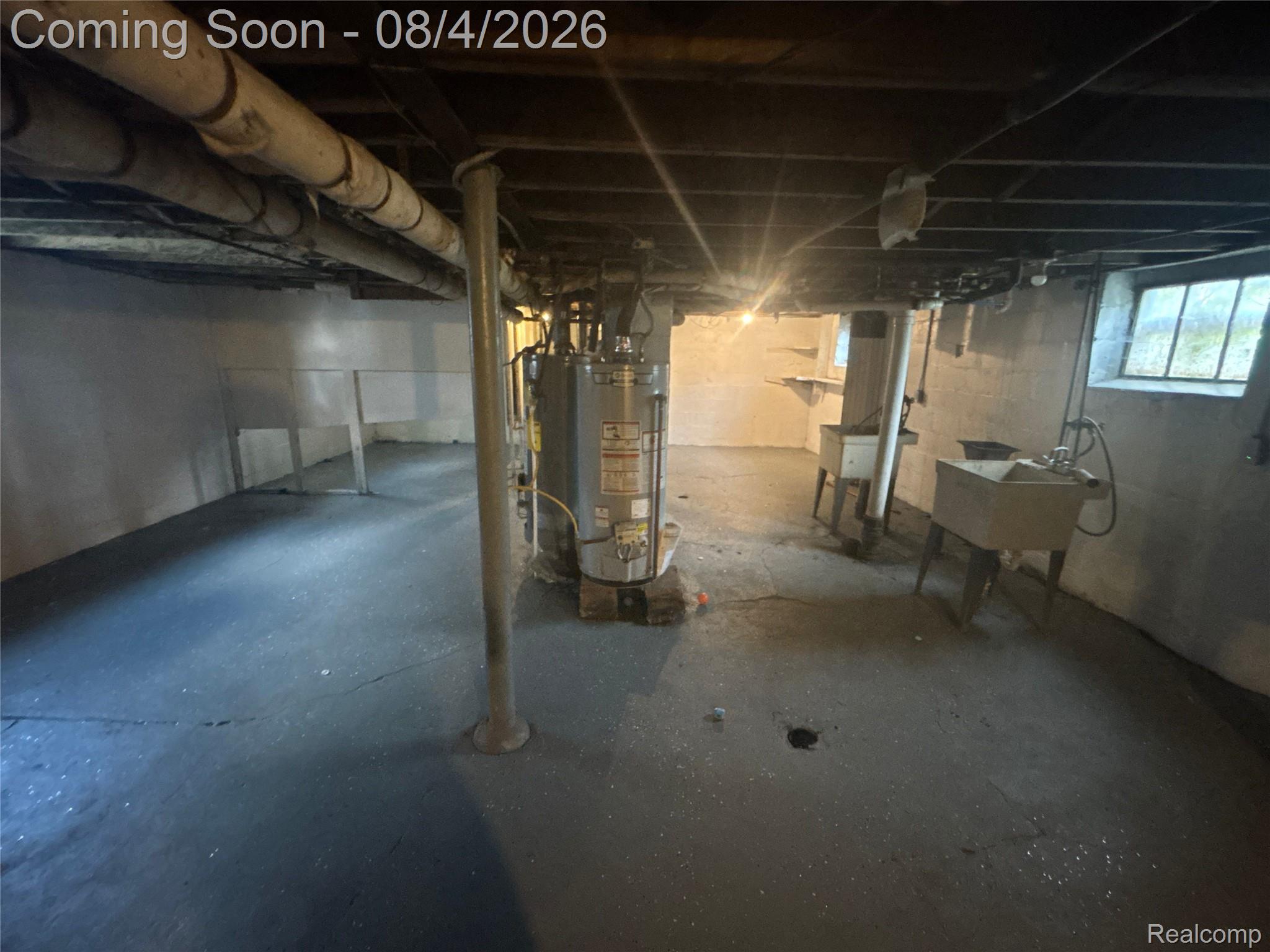 8210 Decatur Street Detroit, MI 48228 - Photo 20 of 24 Unfinished basement featuring exposed overhead piping and structural beams