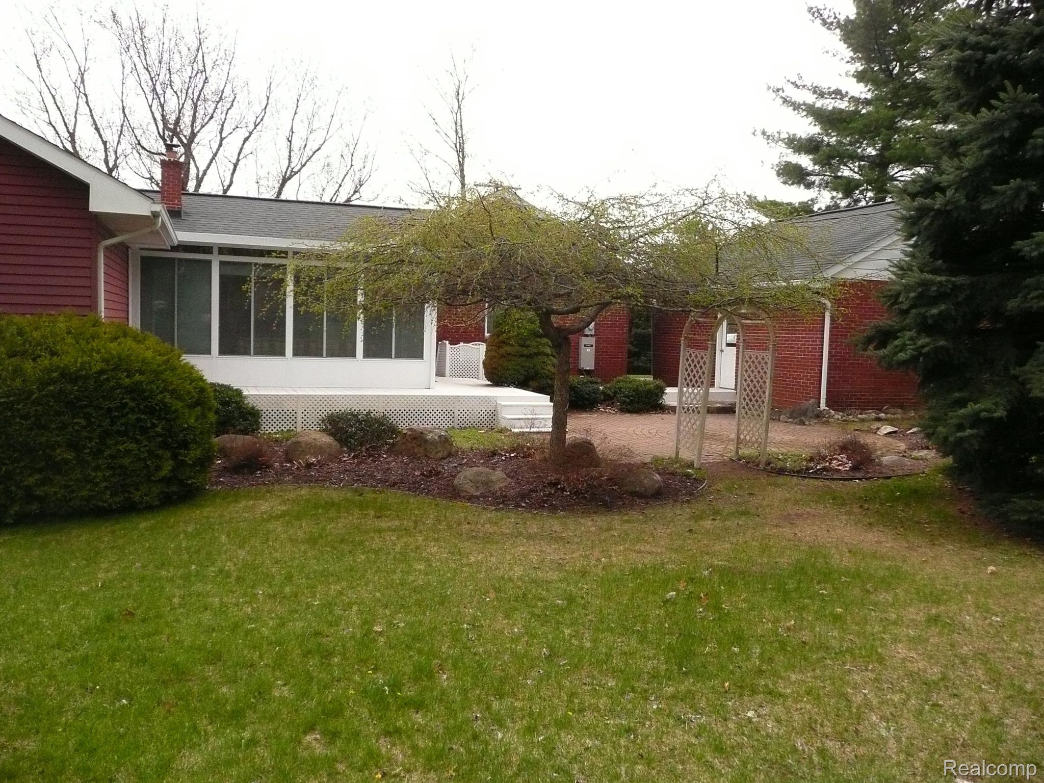 490 Sanders Road Oxford, MI 48371 - Photo 10 of 58 Brick patio court yard off 3 season room