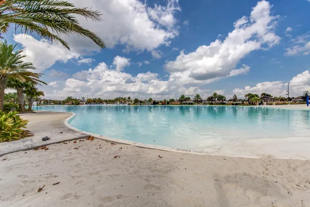 a view of a house with backyard and entertaining space