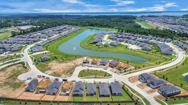 an aerial view of a house a yard basket ball court and outdoor seating