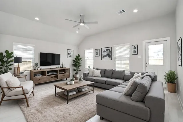 a living room with furniture and a flat screen tv