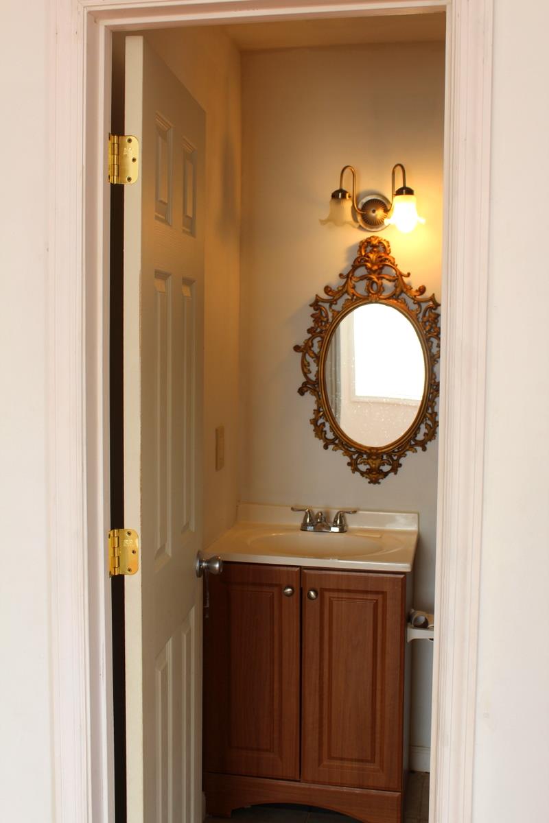 313 Randy Road Madison, TN 37115 - Photo 20 of 22 a bathroom with a sink a mirror and a toilet